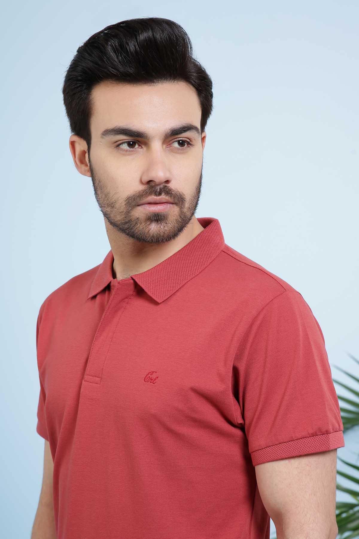 Maroon polo shirt close-up with collar and button placket
