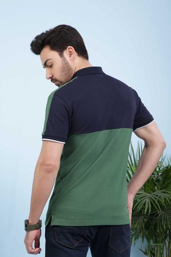 Navy green polo shirt back view with green body, dark sleeves, and striped hem