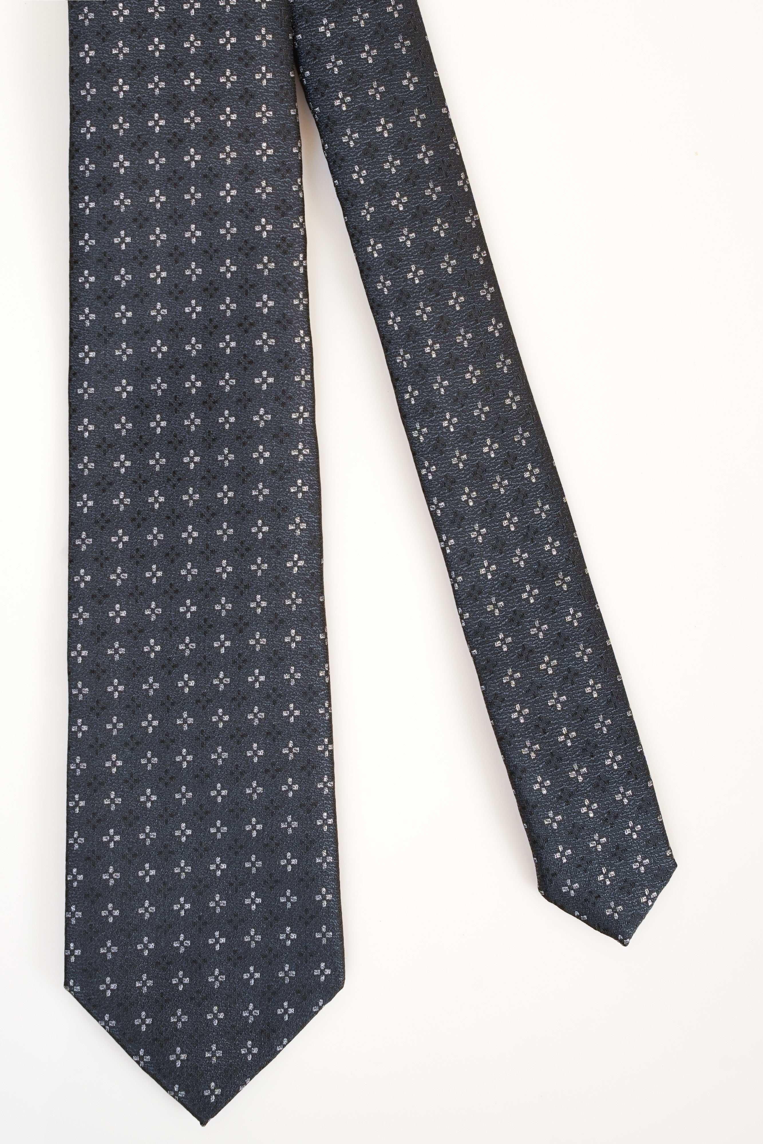 Poly silk tie in dark gray with small repeating flower pattern