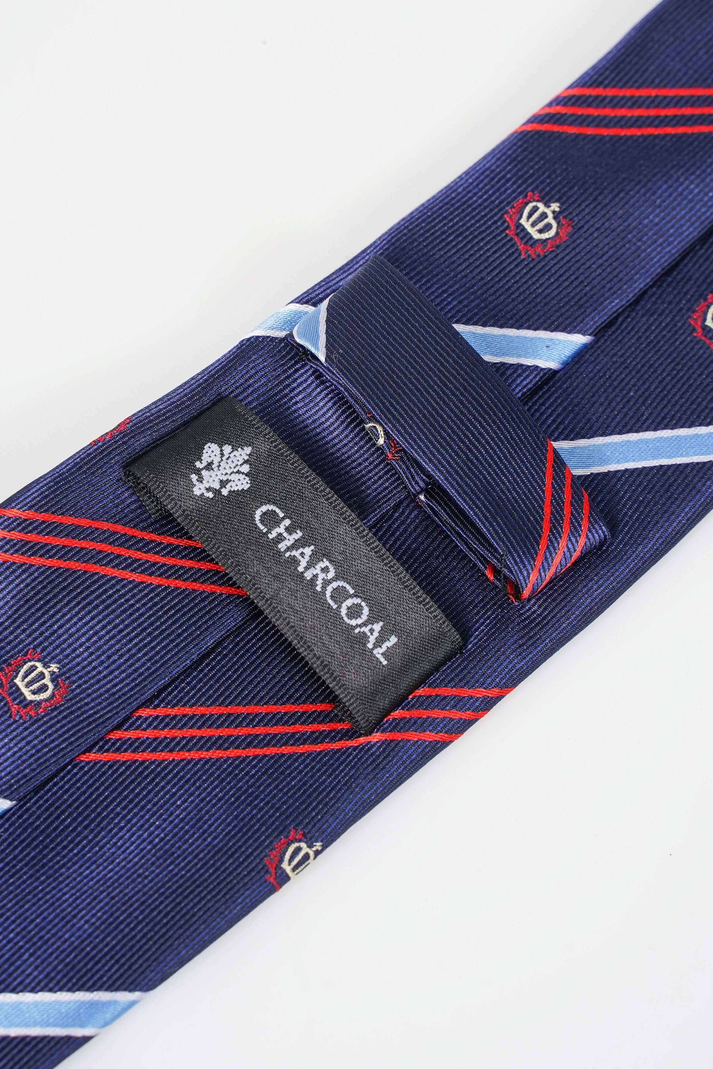 Navy poly silk tie with diagonal stripes; black CHARCOAL tag near tie keeper