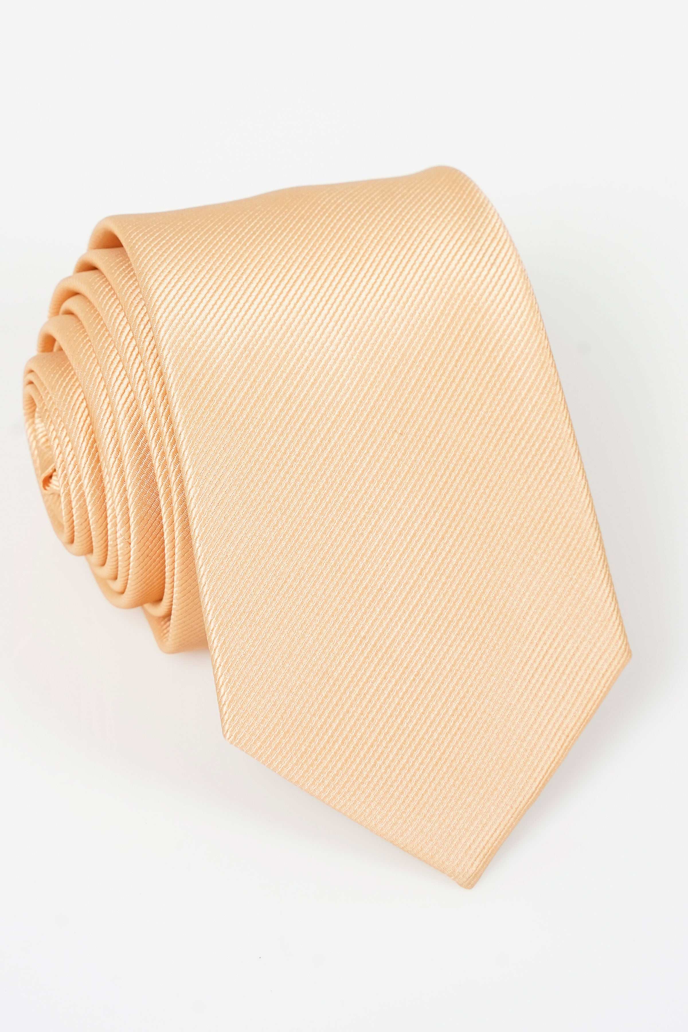Beige textured necktie with subtle diagonal weave, rolled end visible
