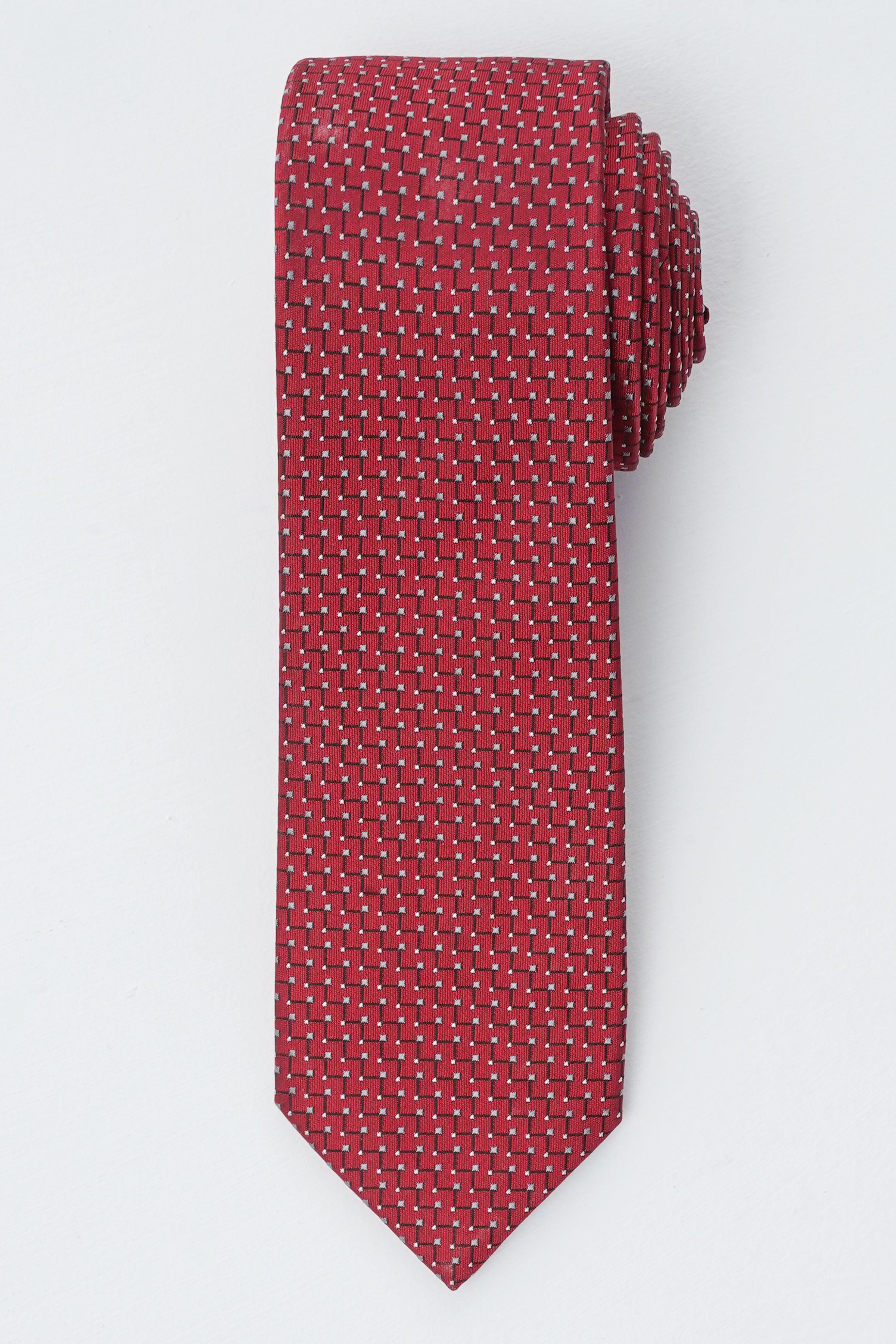 Poly silk tie in deep red with small dotted pattern, narrow pointed end