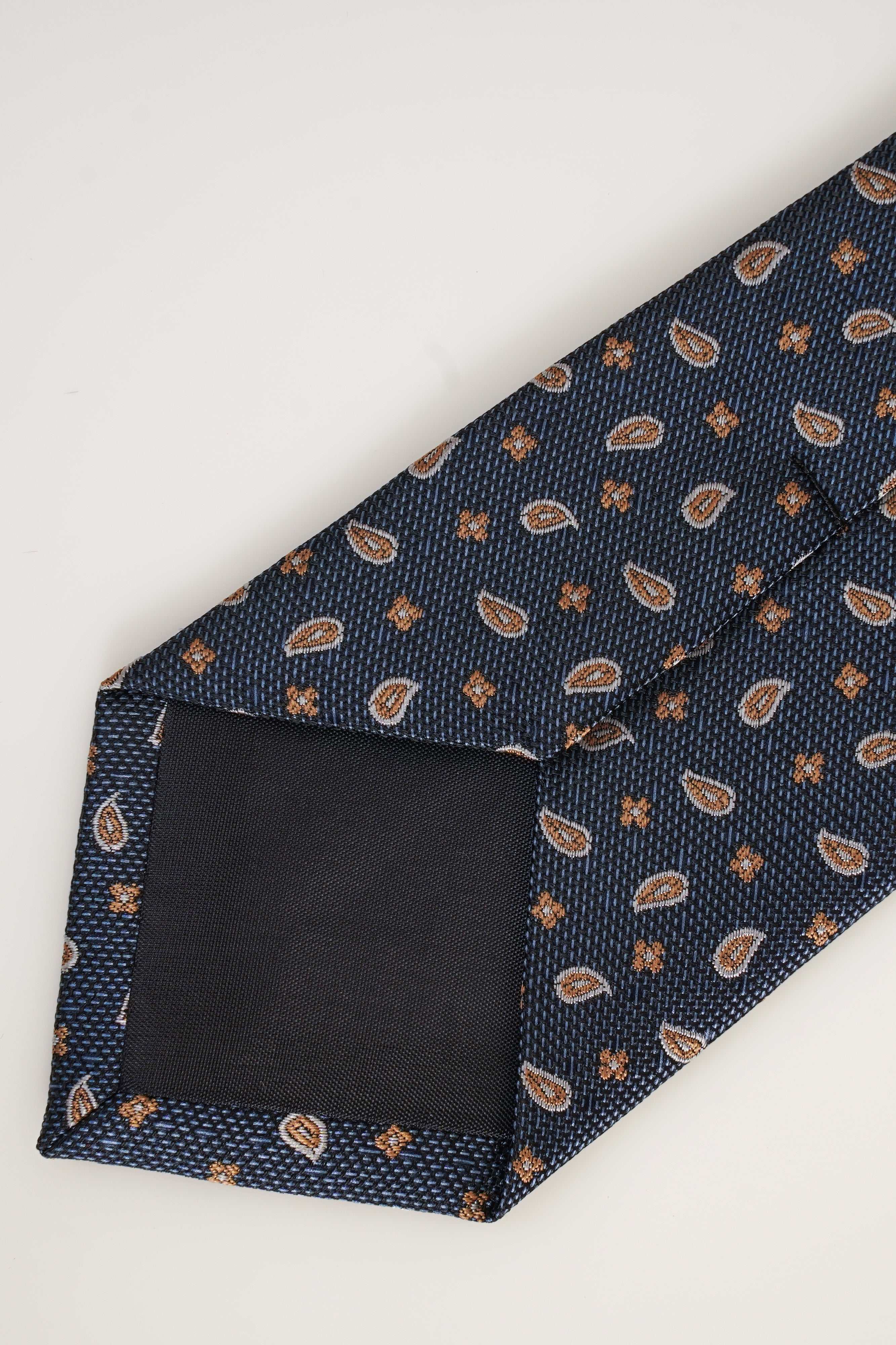 Poly silk tie, navy with scattered tan leaf pattern and textured weave