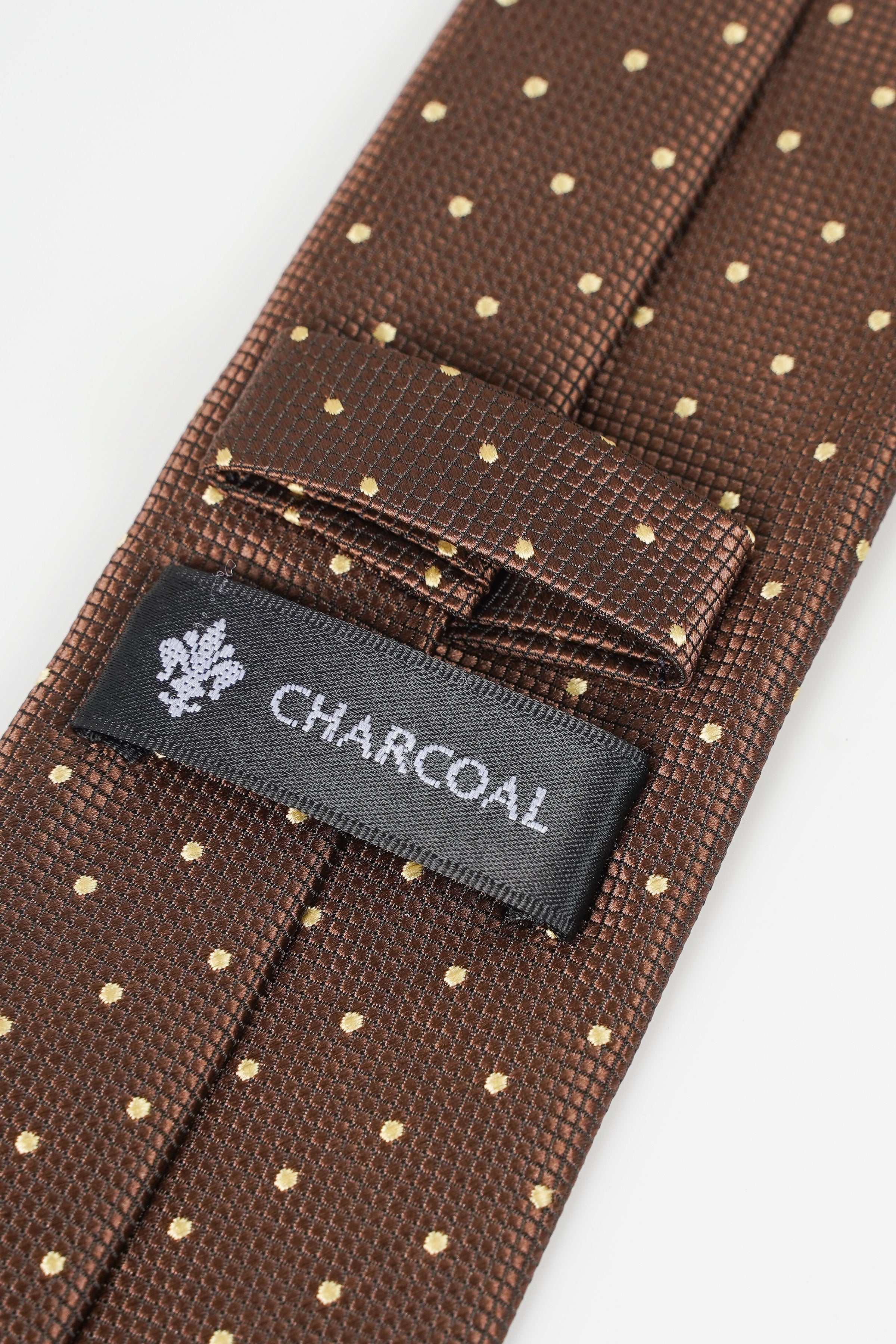 Brown necktie with gold dots and fabric label reading Charcoal