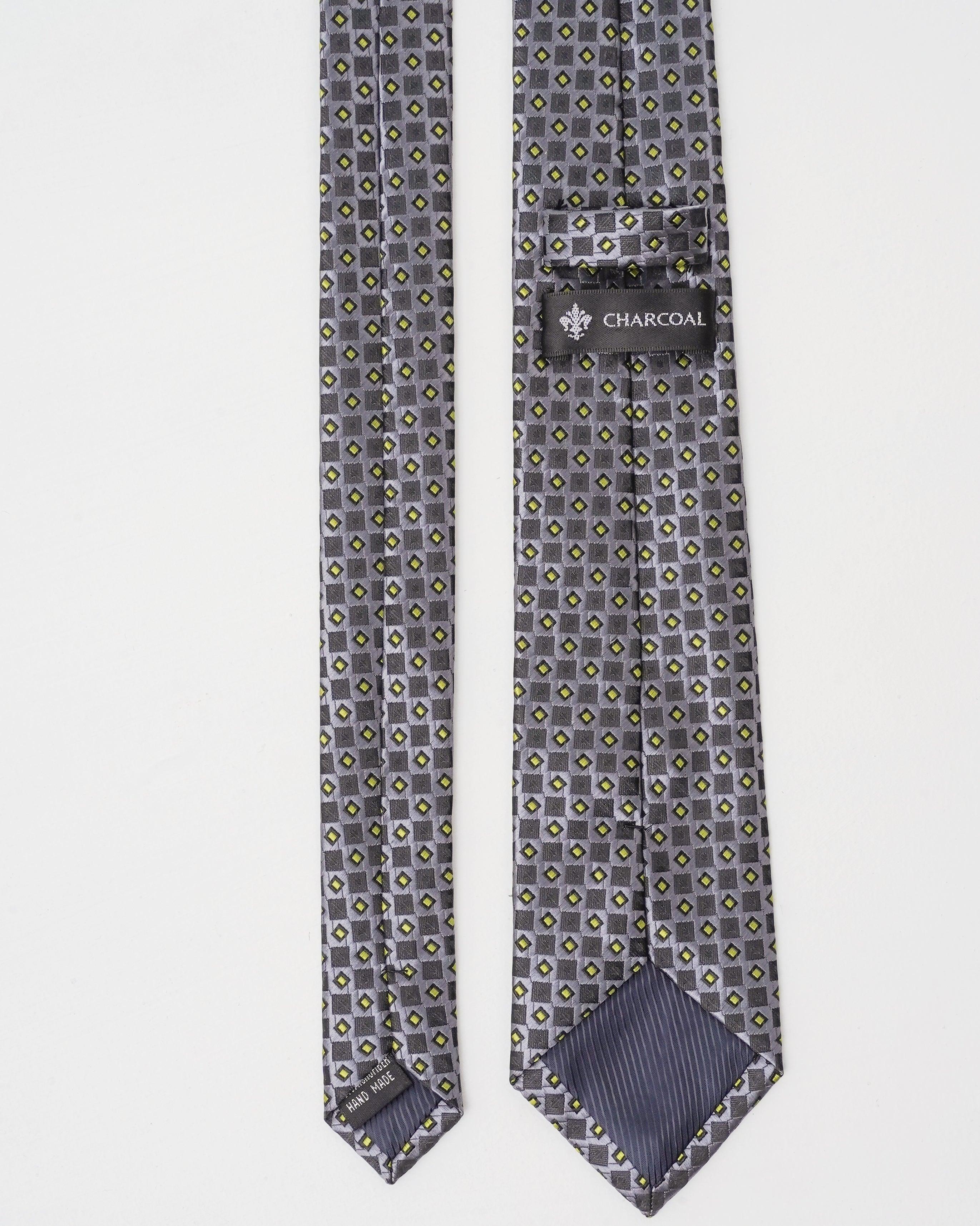 Poly silk tie back view with dark gray geometric pattern and 'CHARCOAL' label
