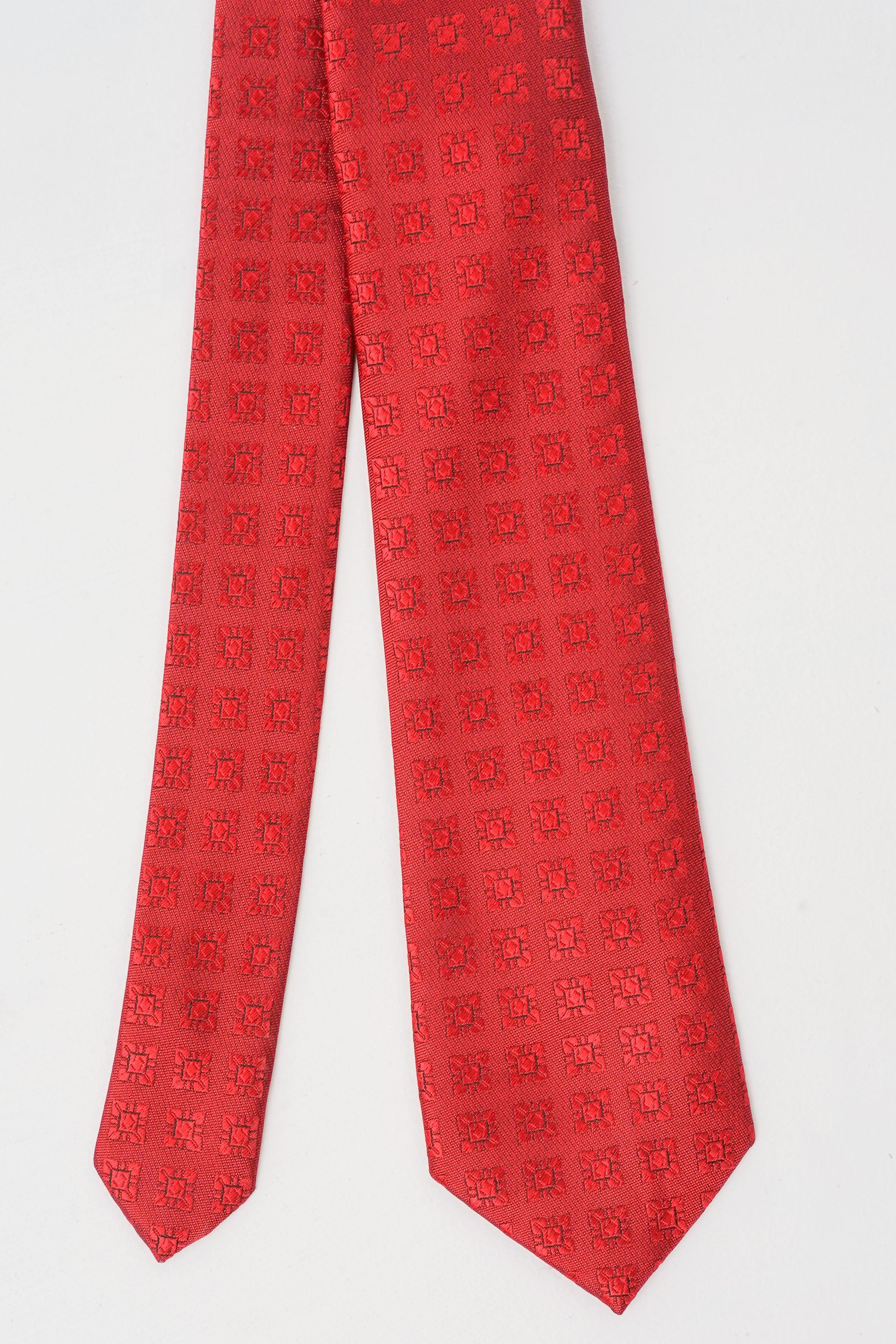 Red patterned polyester silk tie, full length with pointed ends