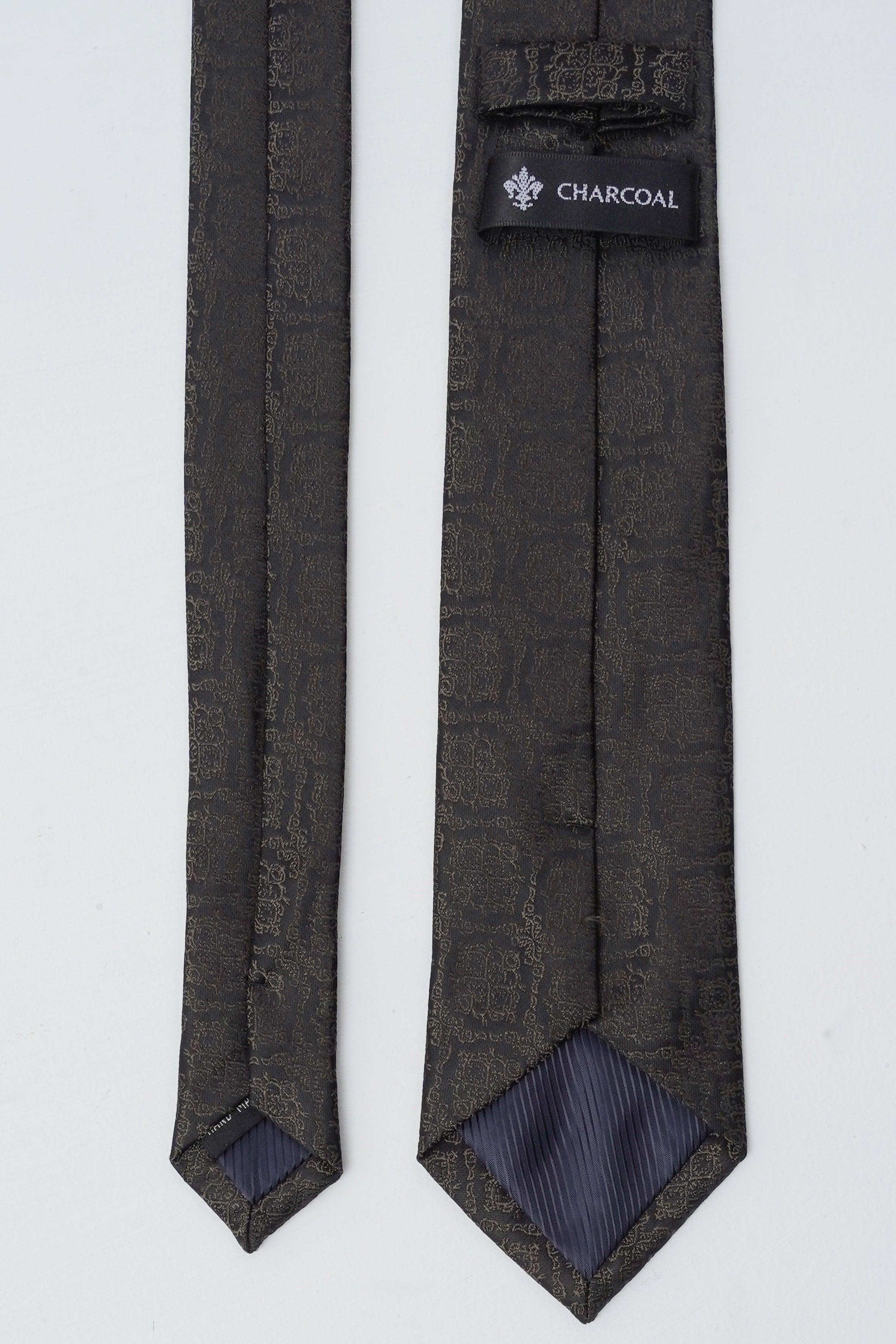 Charcoal tie with branded label at keeper and small repeating pattern