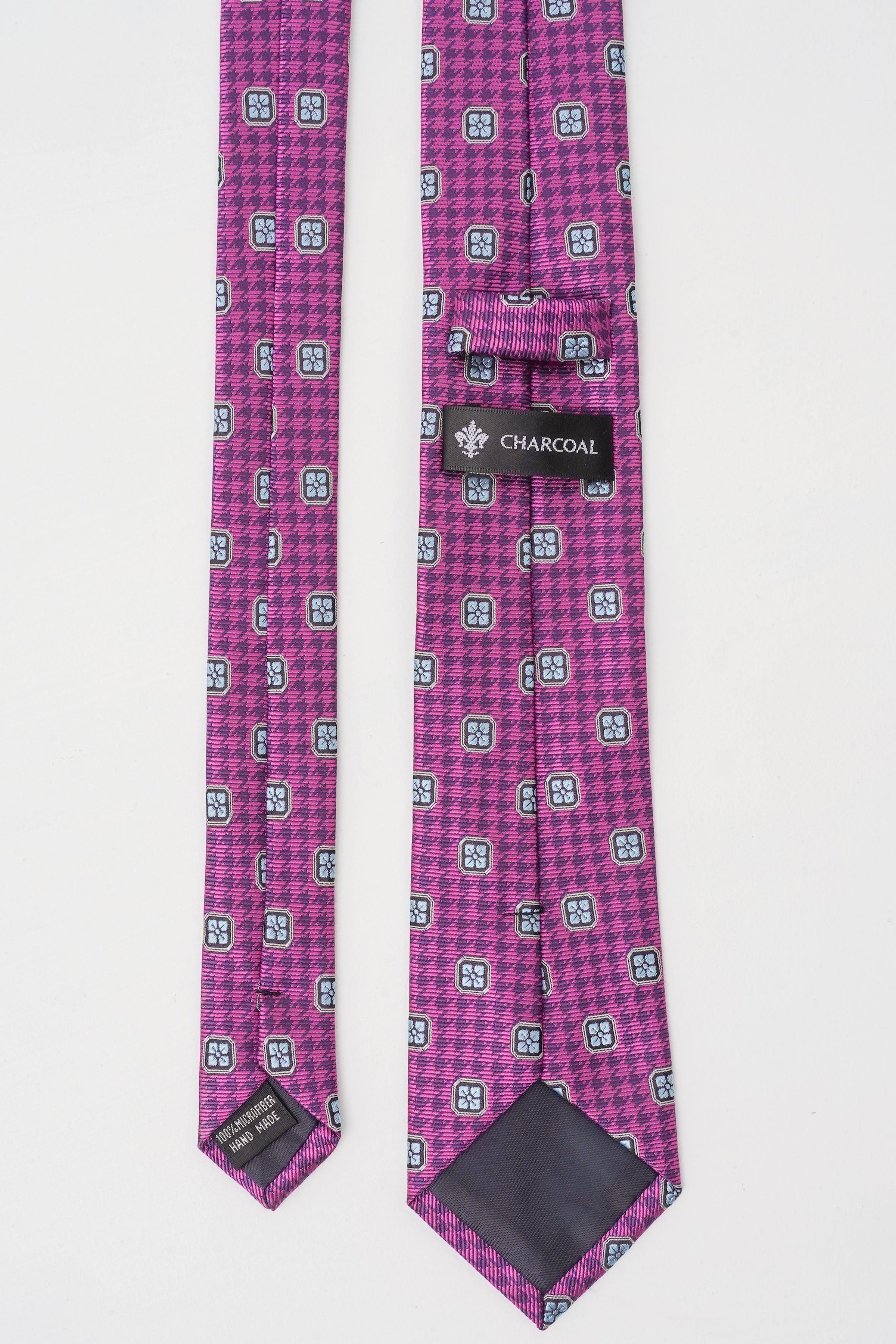 Purple poly silk tie with patterned surface and charcoal logo label at end