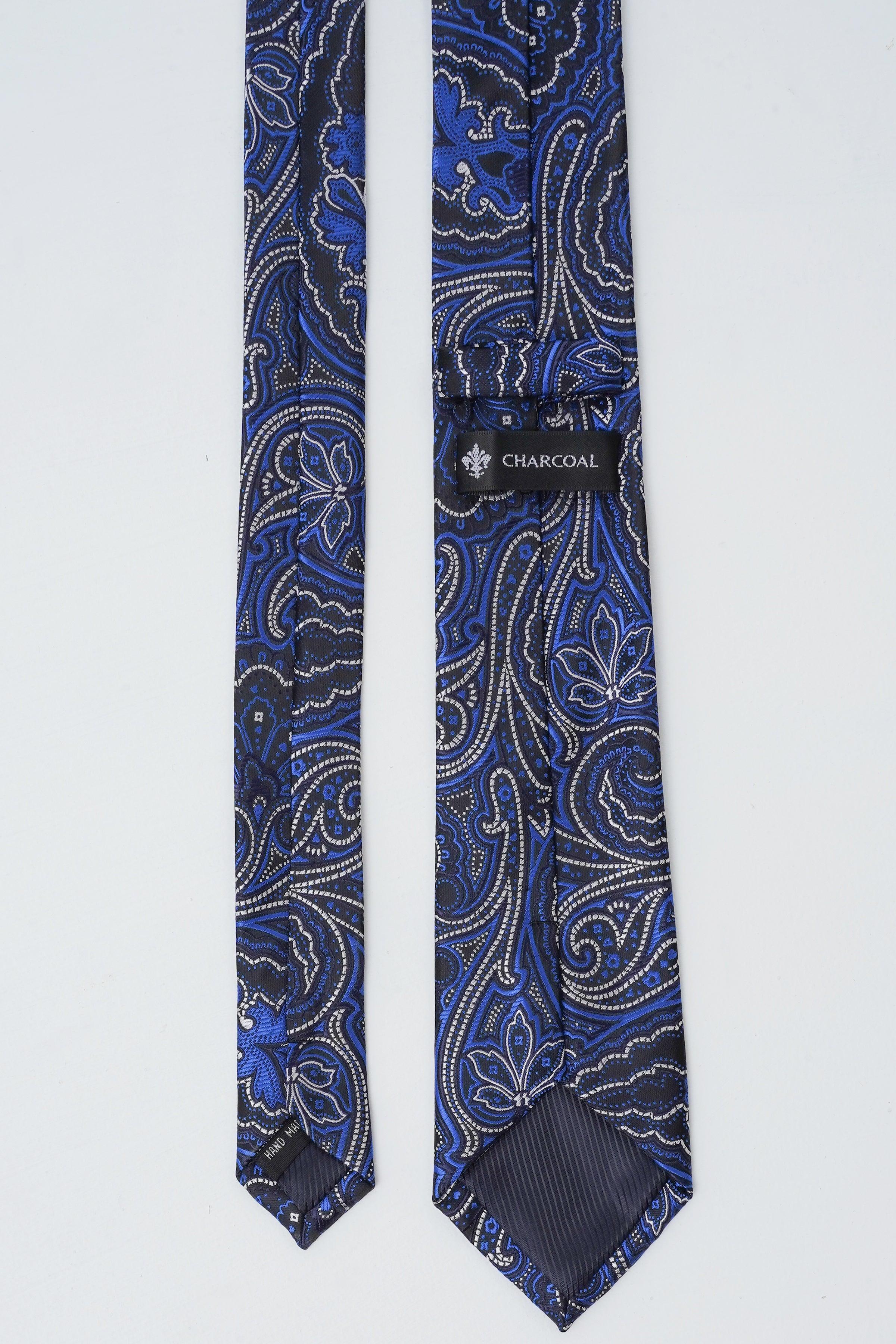 Poly silk tie, blue paisley print, charcoal label visible on tie keeper
