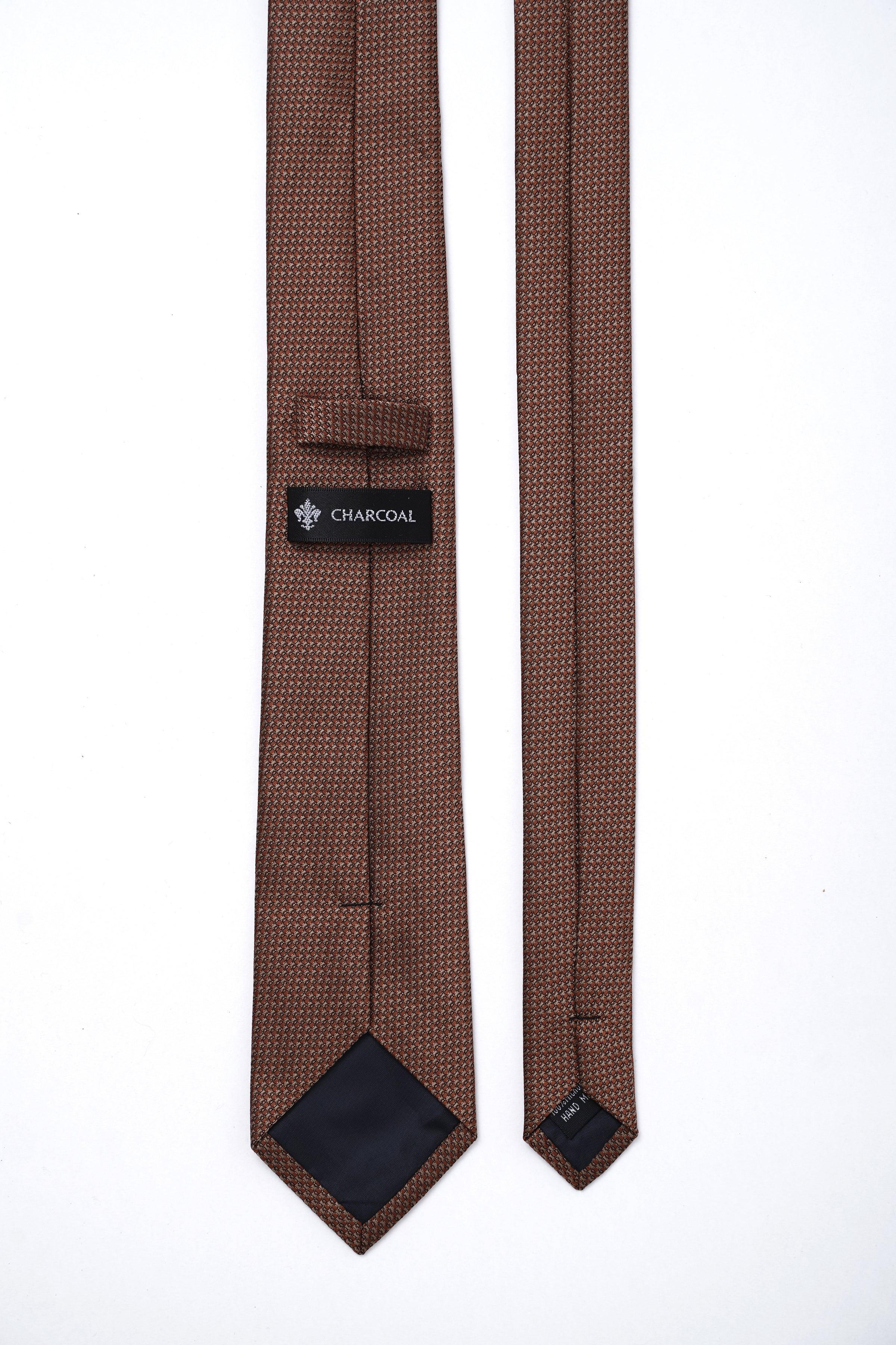 Brown tie with back strap and CHARCOAL tag, pointed ends