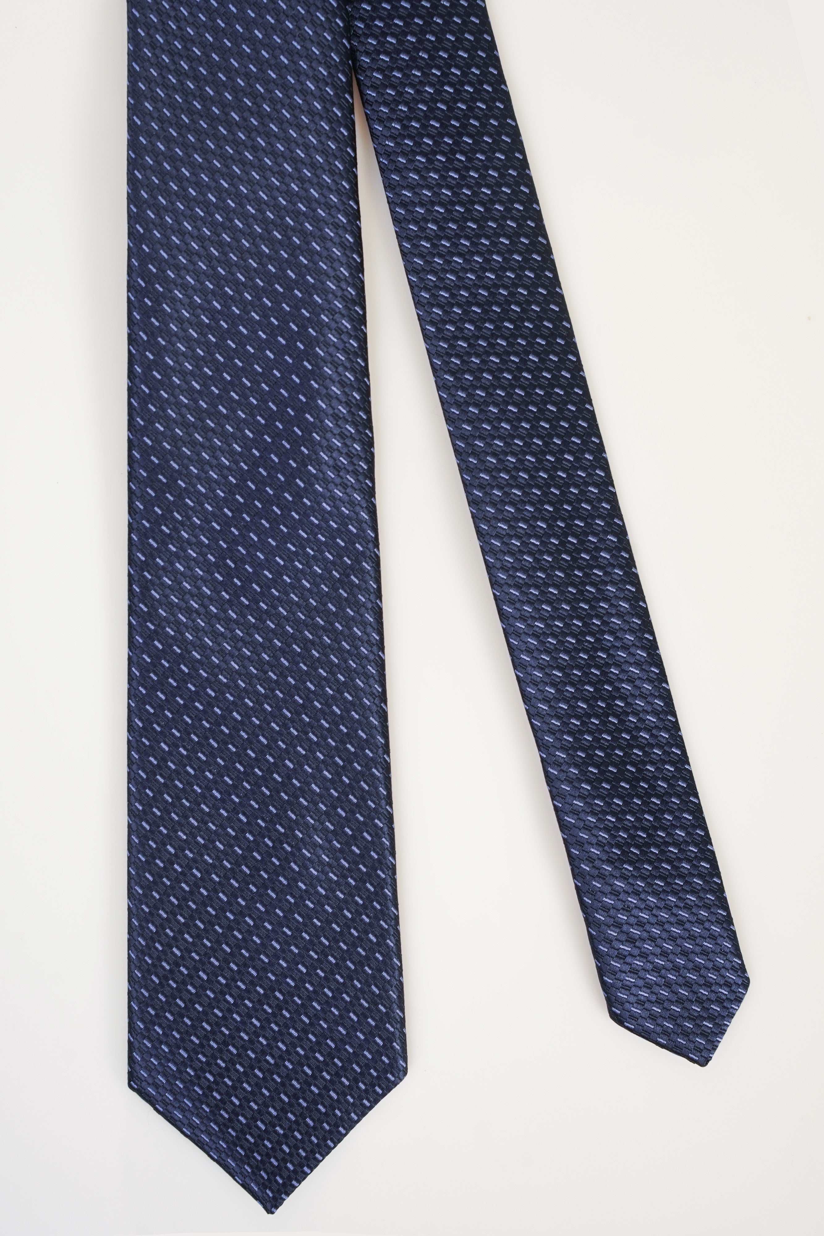 Navy patterned polyester silk tie with narrow woven texture, straight hanging end