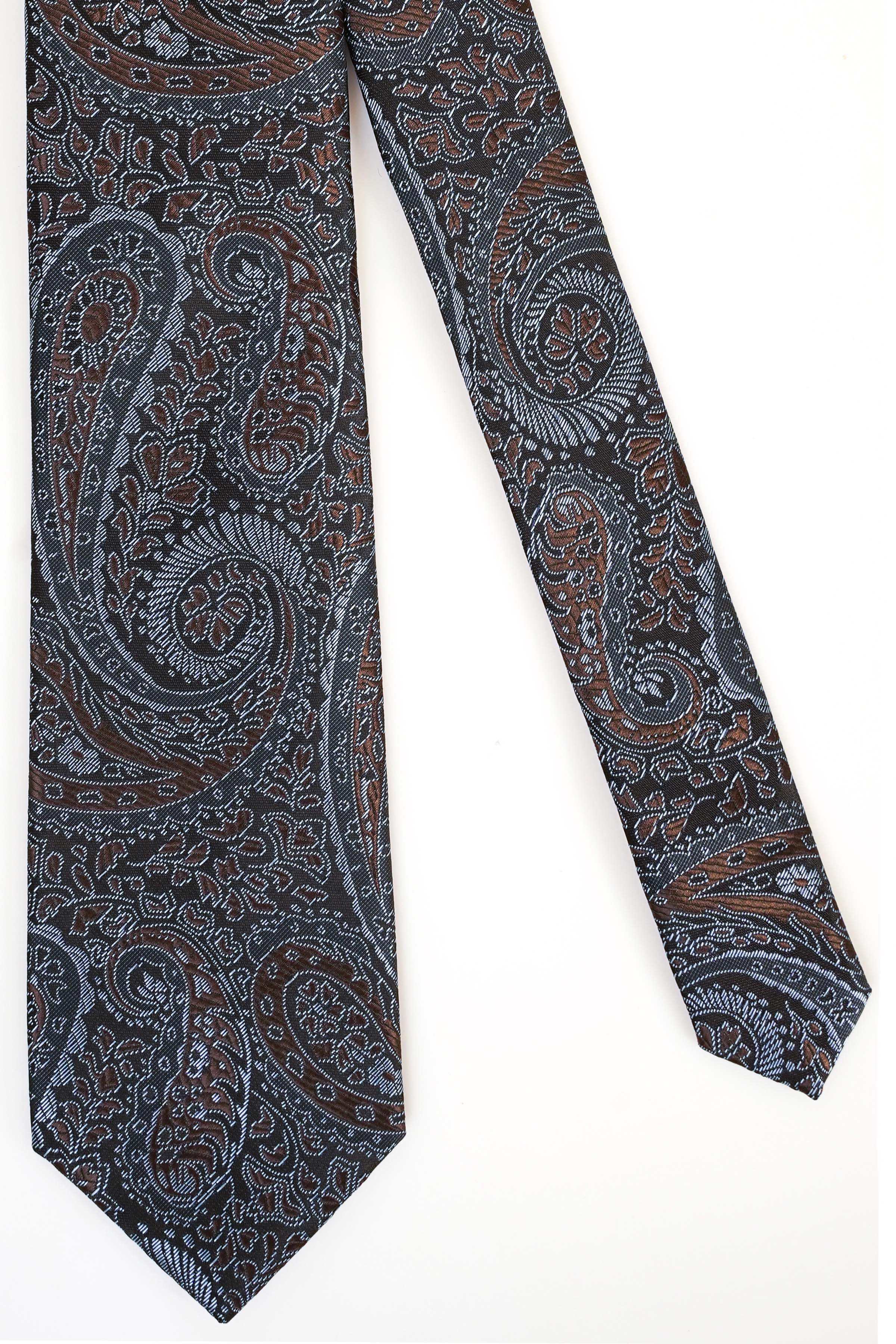 Paisley polyester necktie in dark blue with rust and teal swirls, straight hanging.
