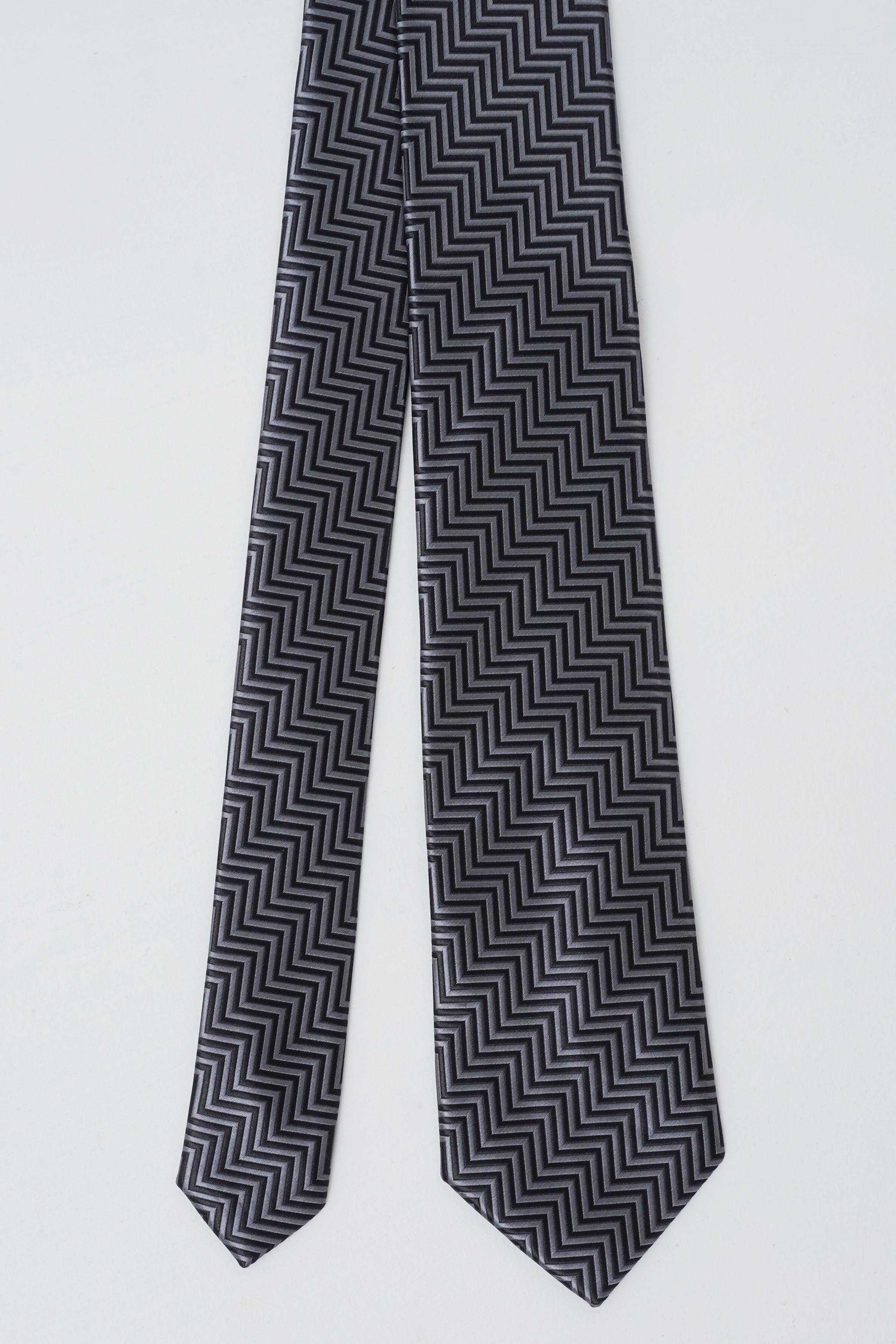 Chevron-pattern necktie with dark zigzag stripes and pointed tips
