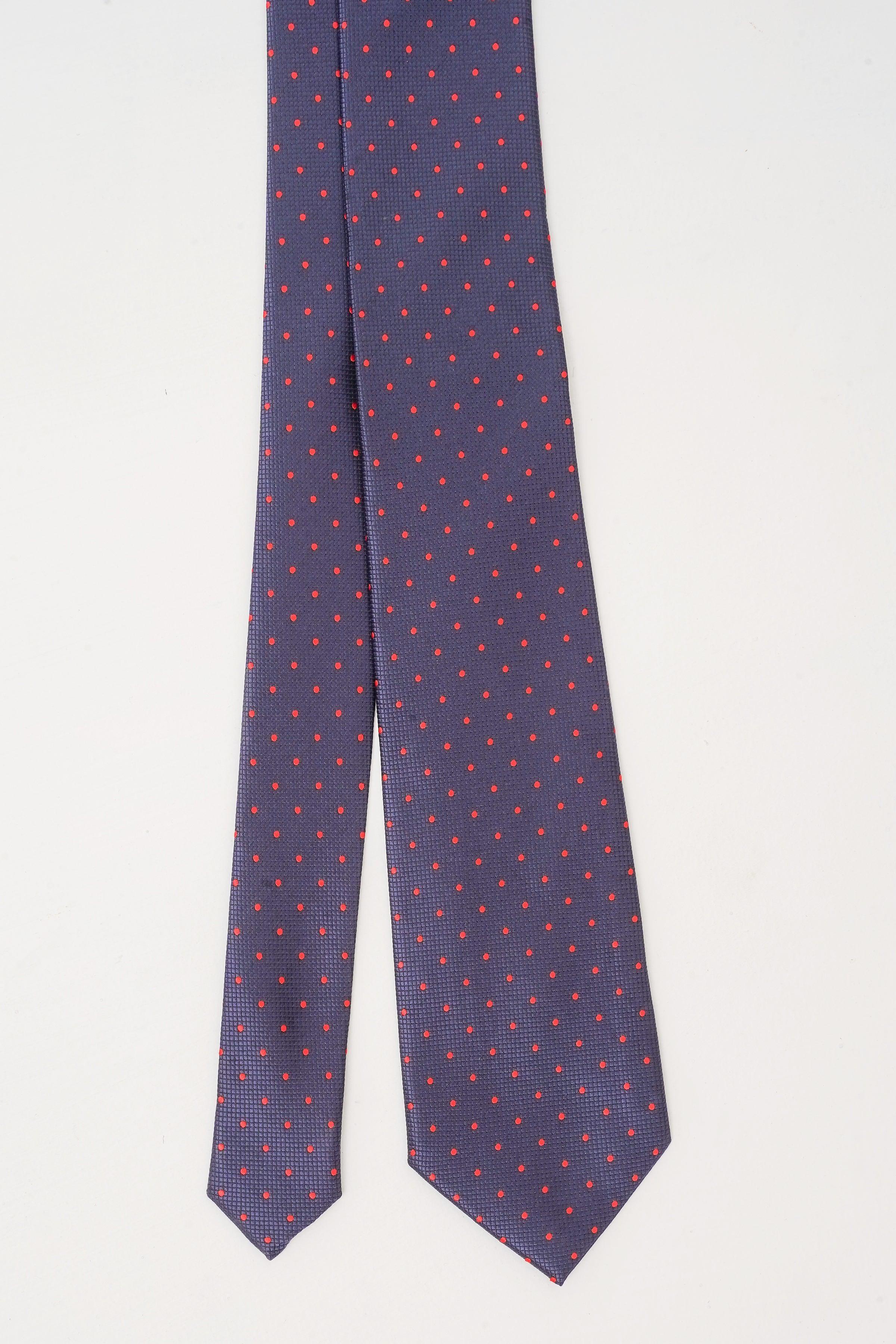 Poly silk tie hanging, dark navy with small red dot pattern