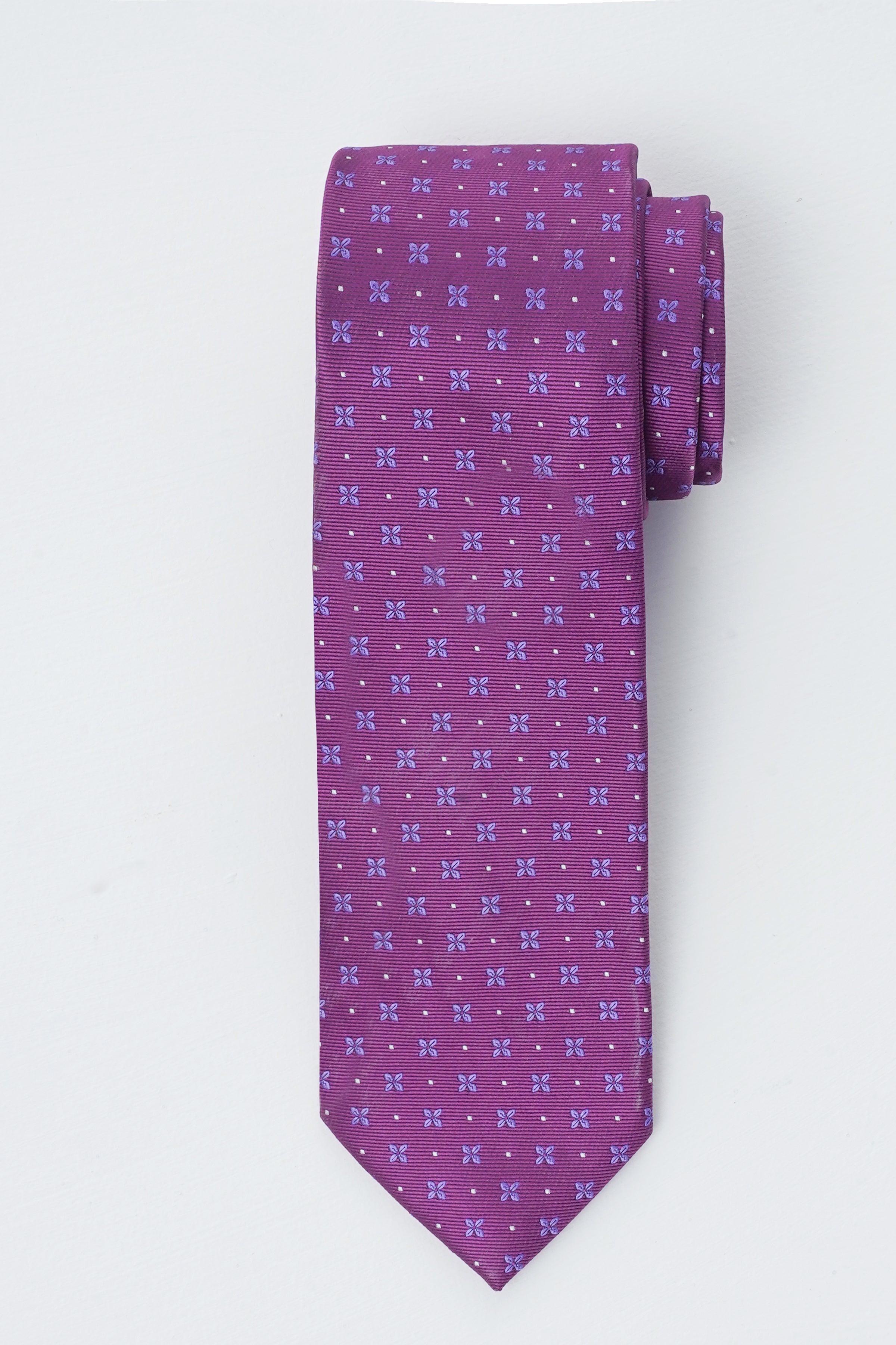 Purple poly silk tie with small repeating pattern, single front view.