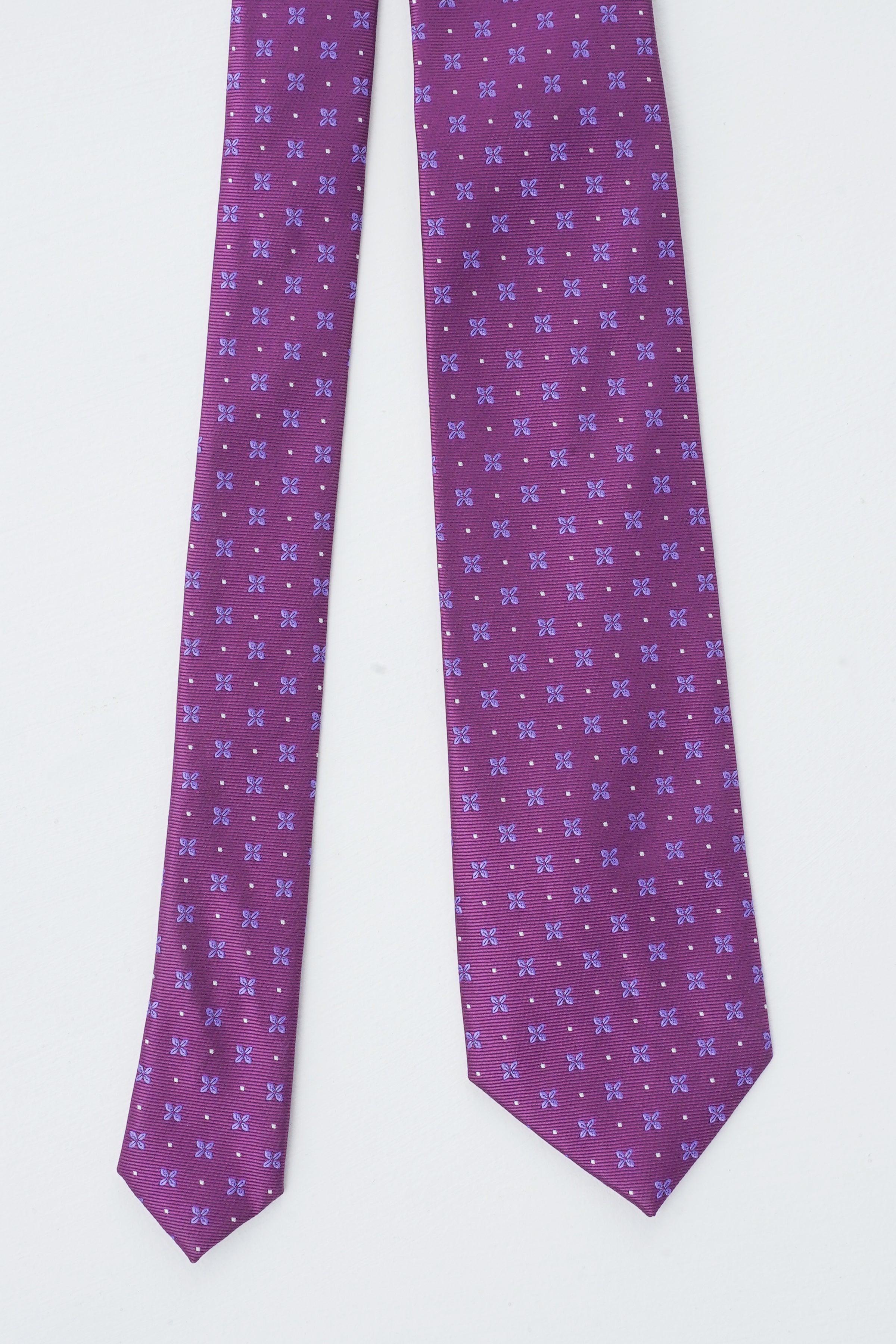 Purple poly silk tie with small repeating pattern, shown flat and folded.