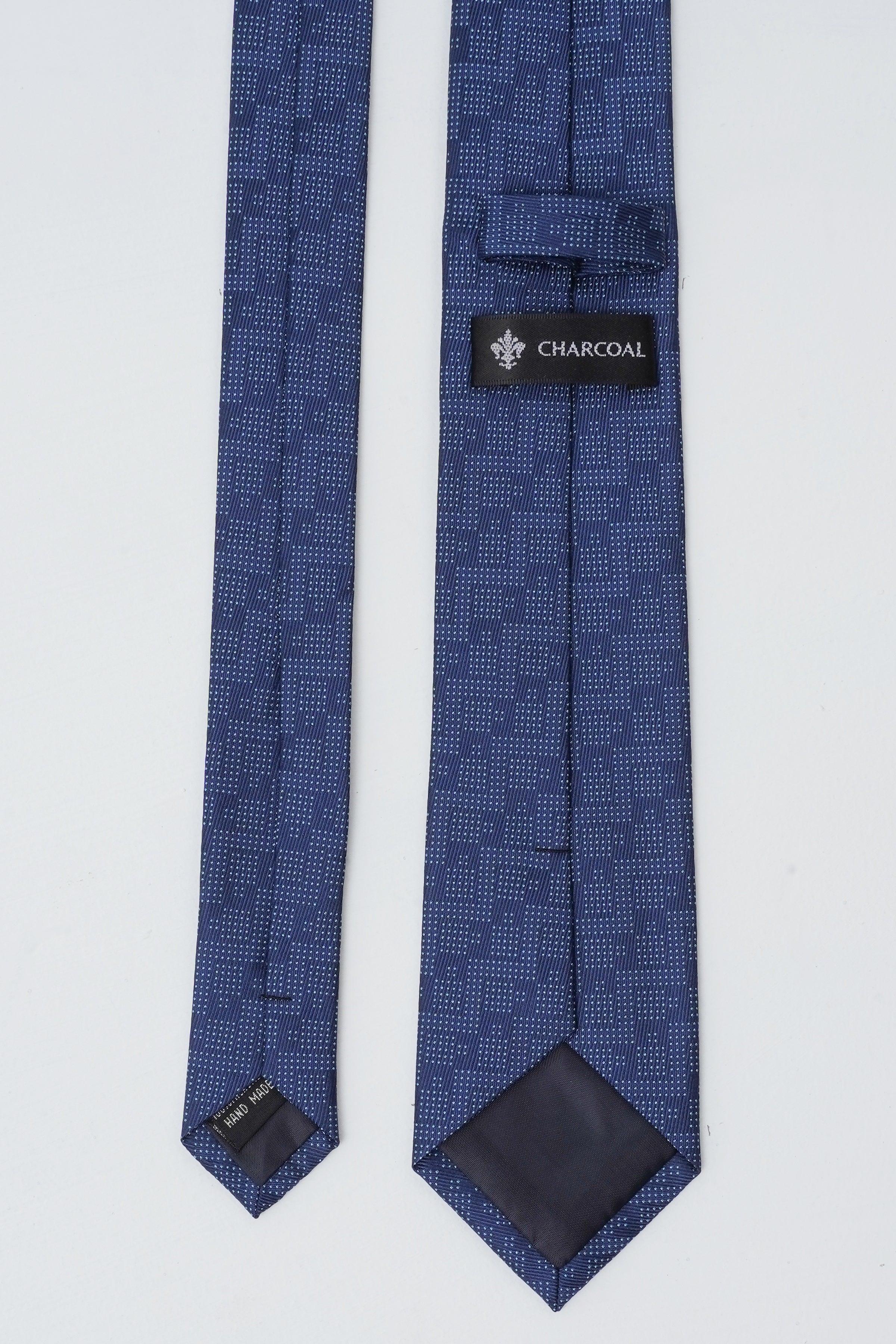 Navy blue poly silk tie with geometric pattern and Charcoal tag at end