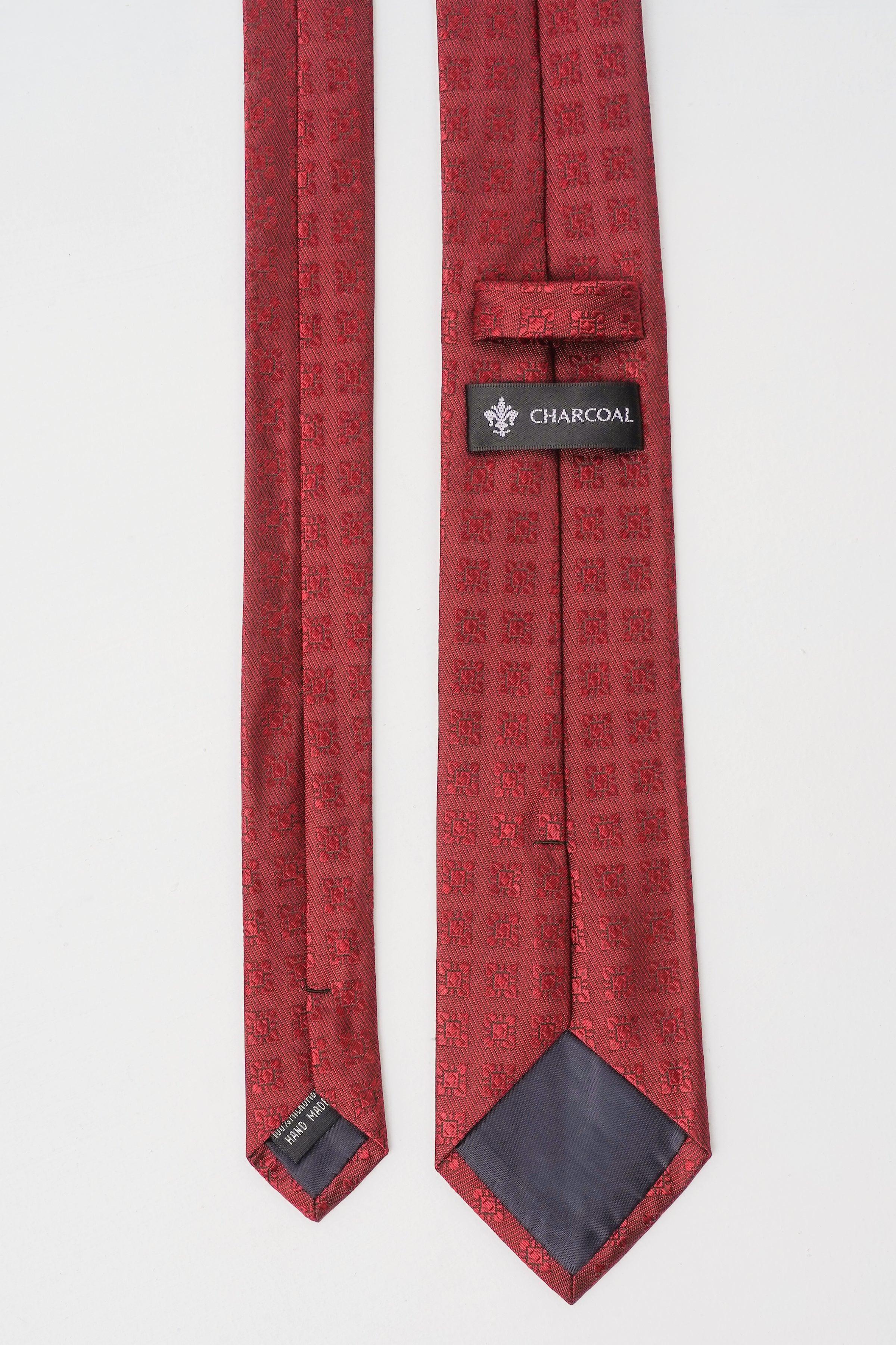 Red poly silk tie with charcoal label at keeper and dark underside tip