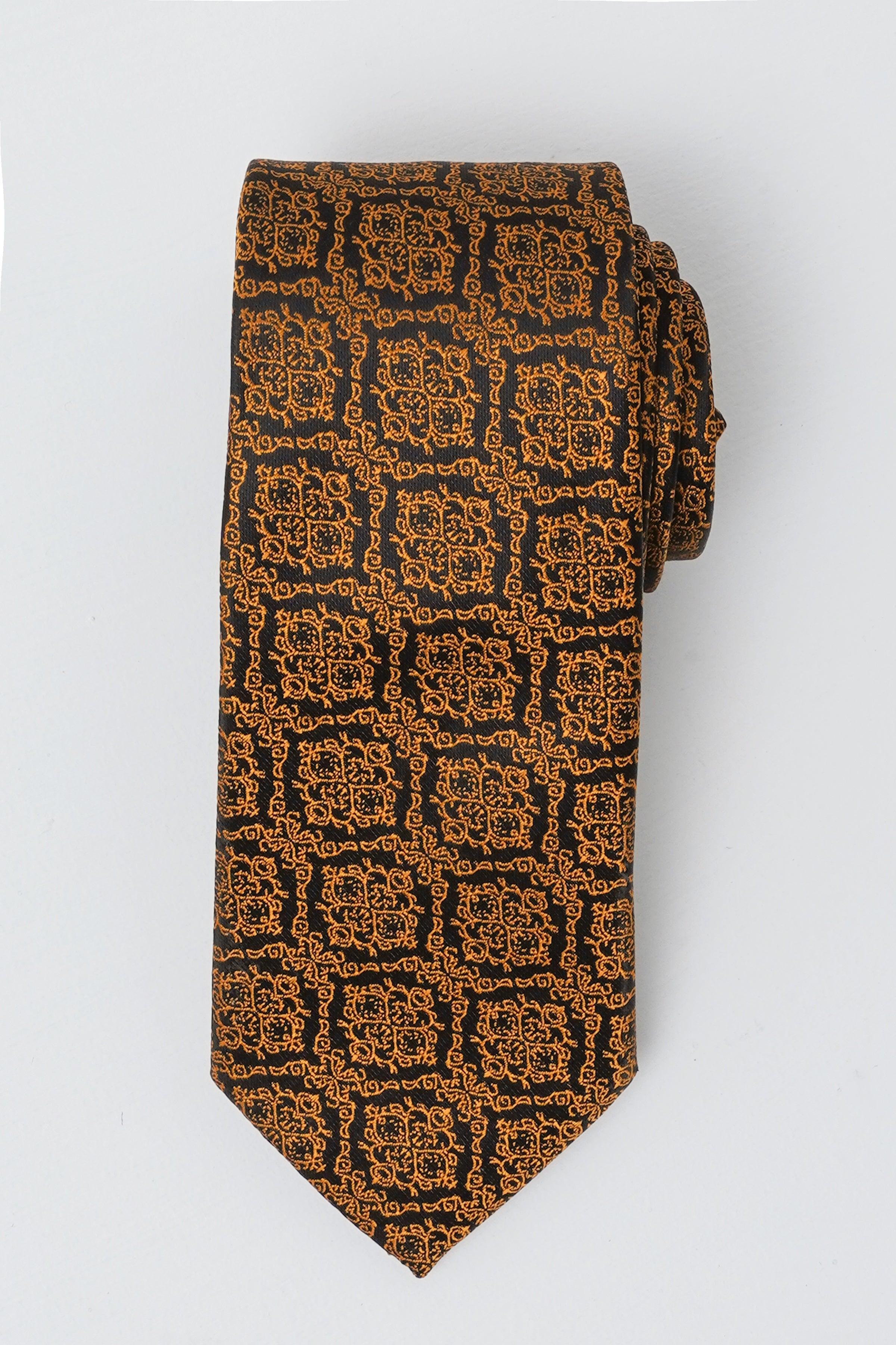 Poly silk tie with brown and navy geometric pattern, pointed ends