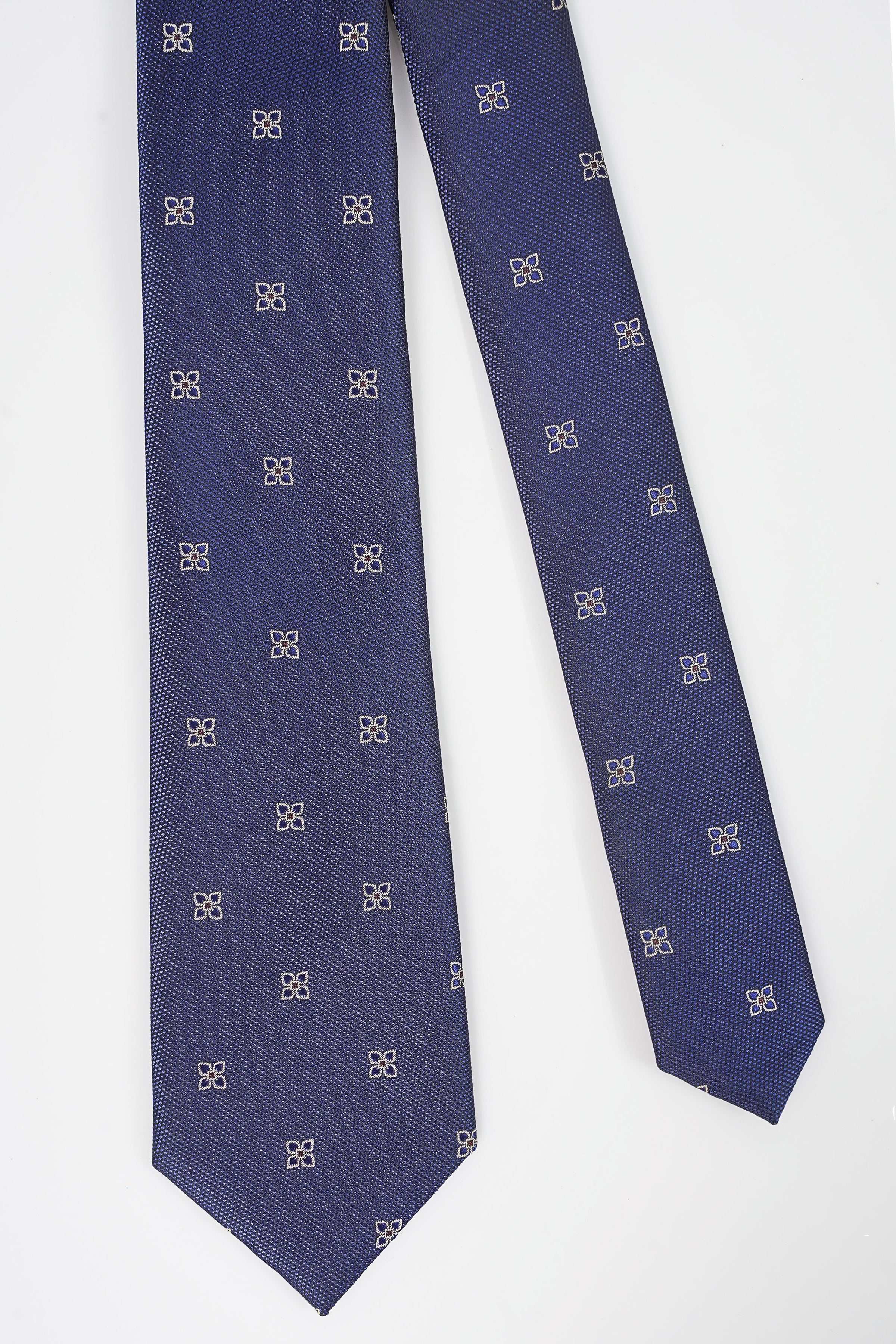 Dark blue necktie with small all-over geometric pattern in gold and silver