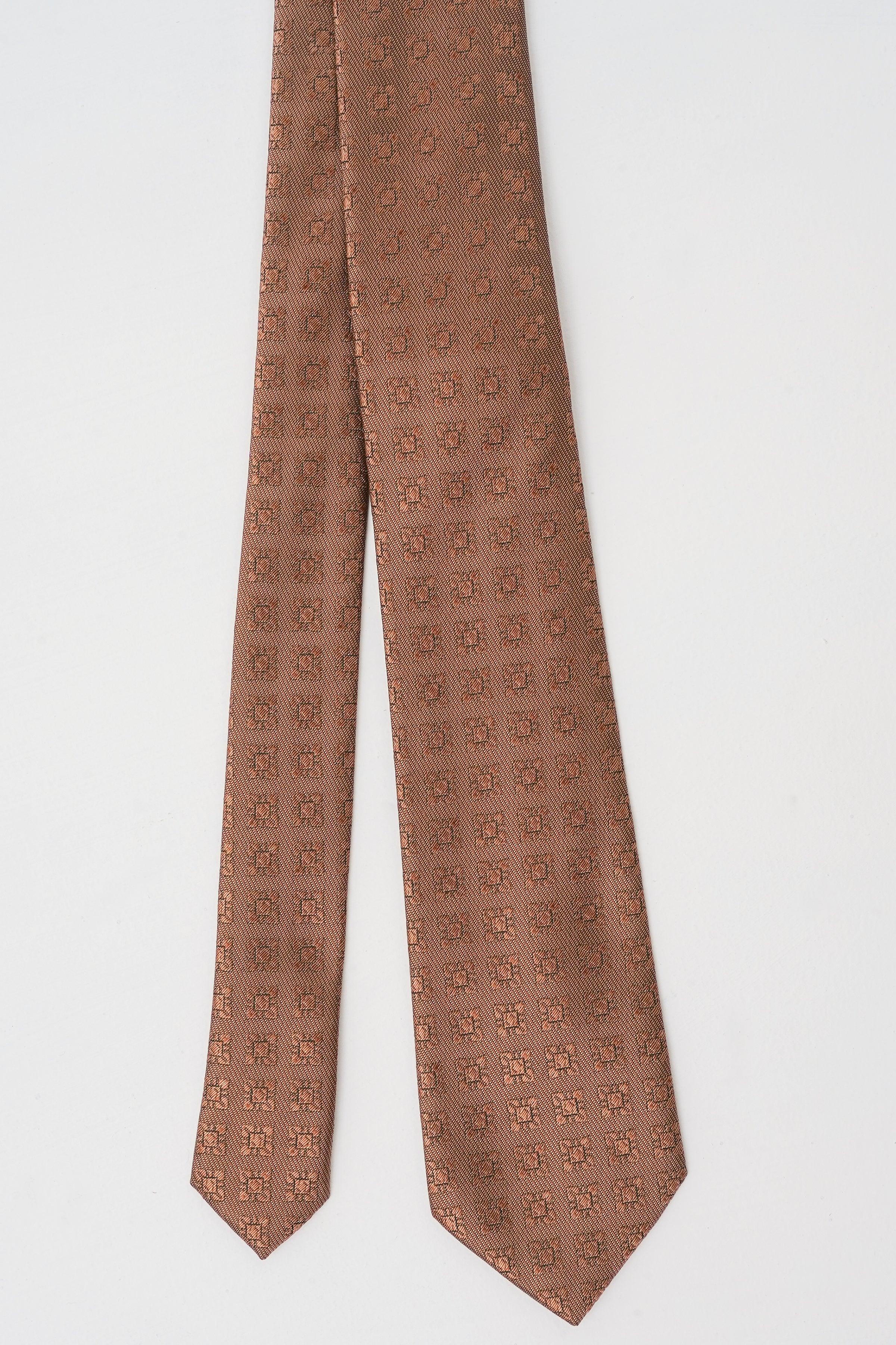 Brown poly silk necktie with repeating allover logo pattern.