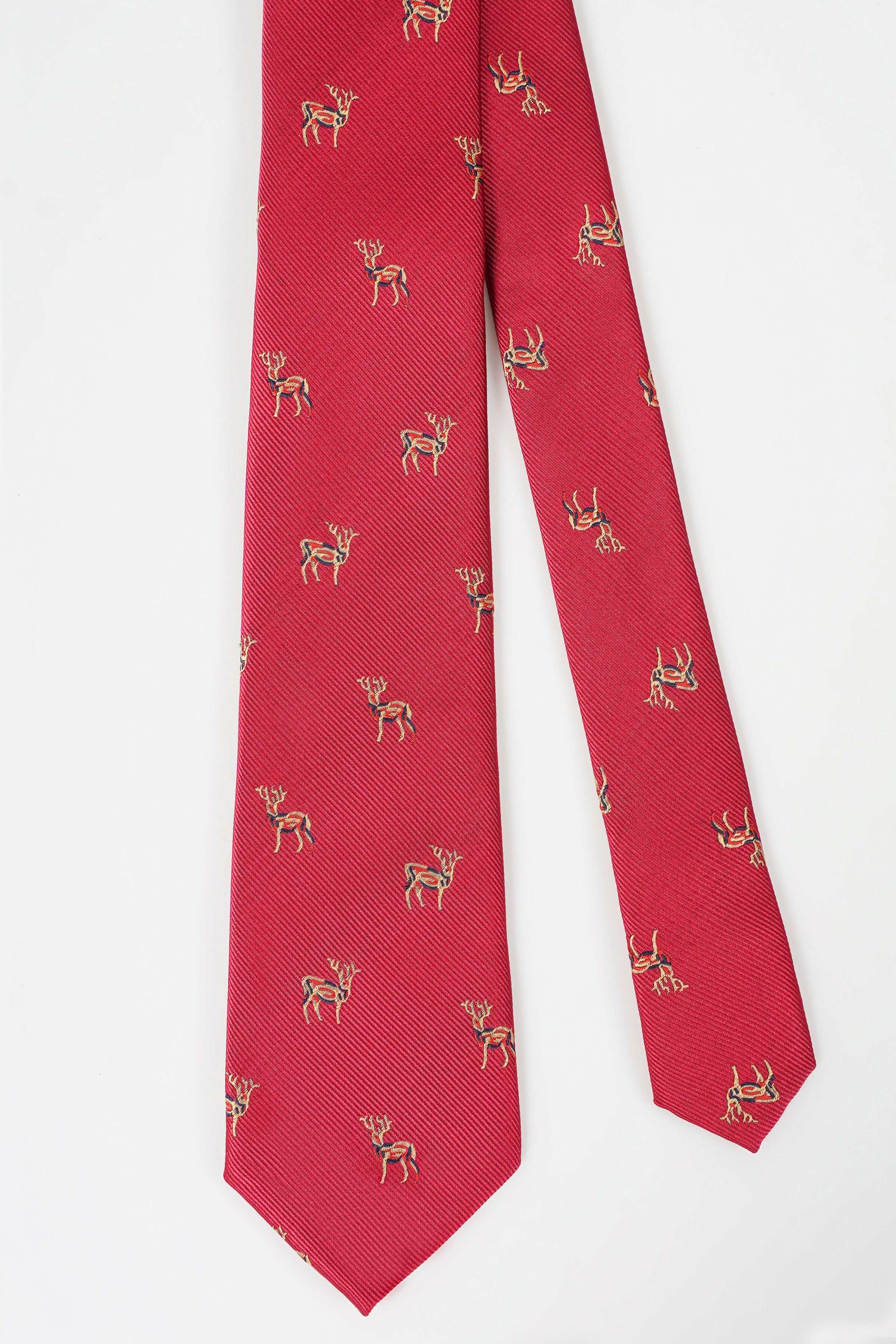 Red poly silk tie with all-over gold animal motif, long narrow shape