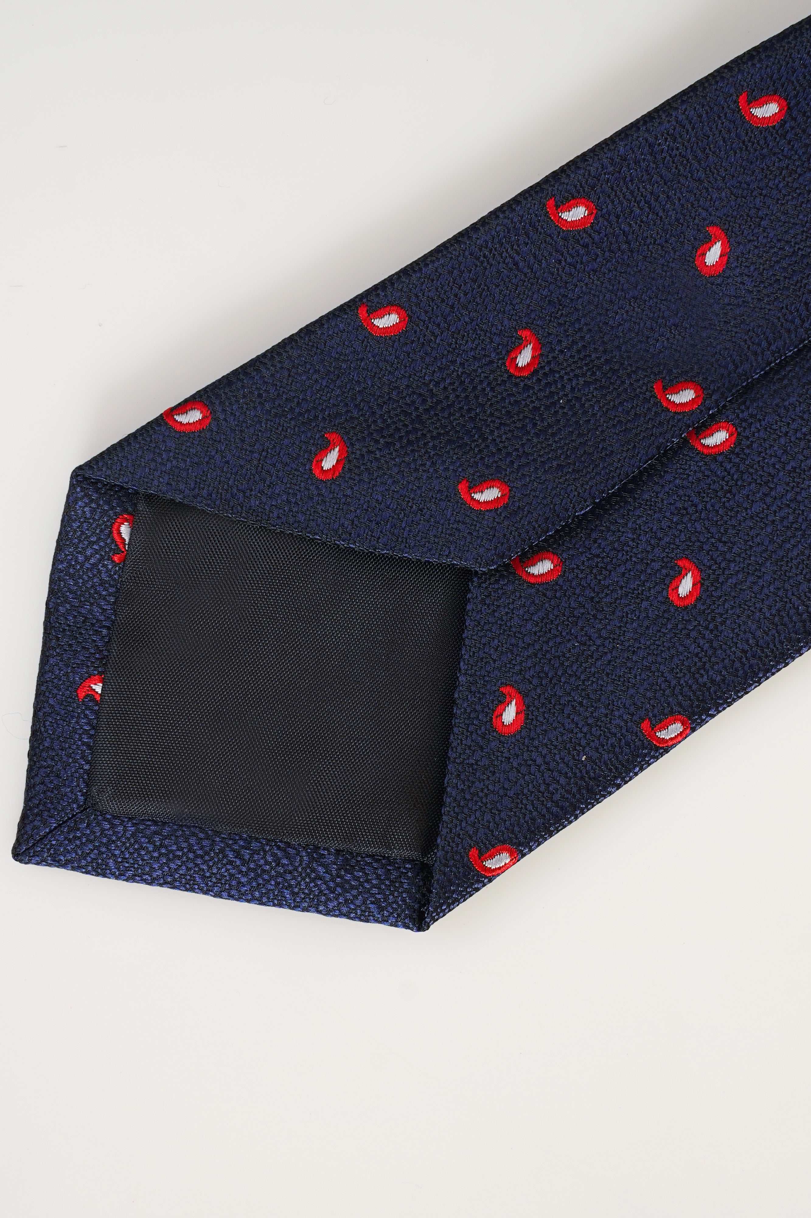 Navy poly silk tie with red teardrop motif and textured weave.