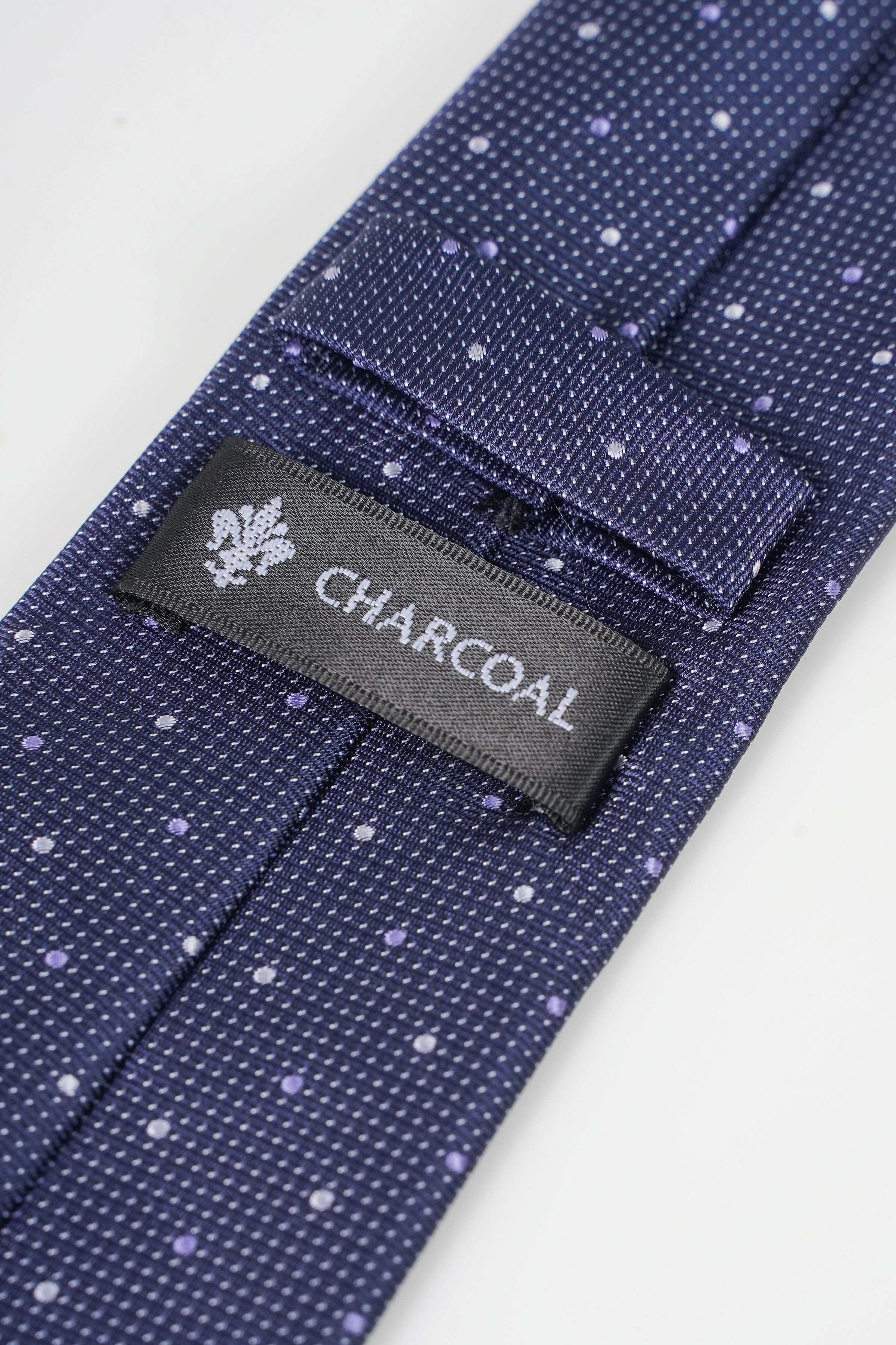 Dark blue tie with small white dots and CHARCOAL fabric label