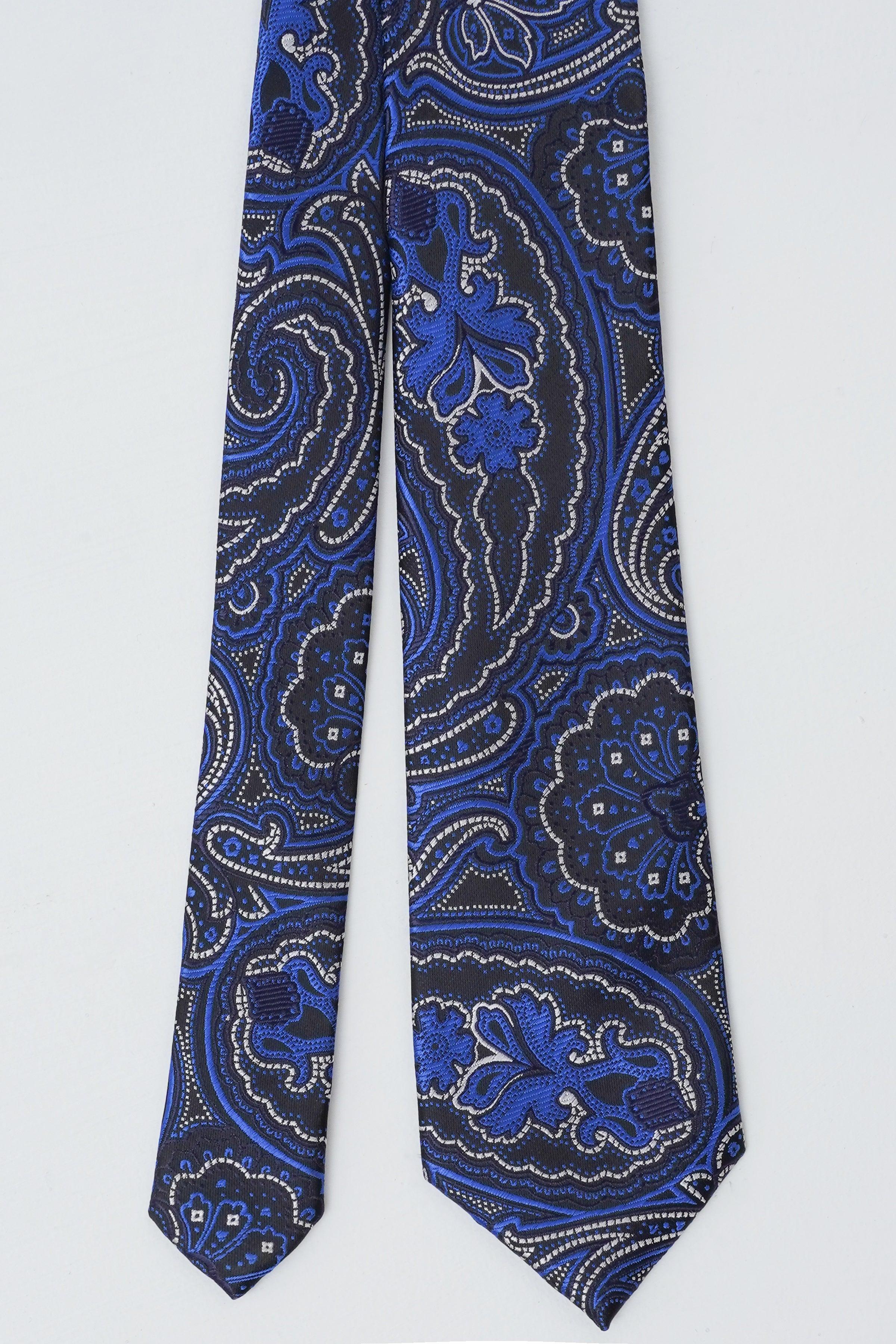 Poly silk tie in deep blue with ornate paisley and scroll pattern, pointed tip