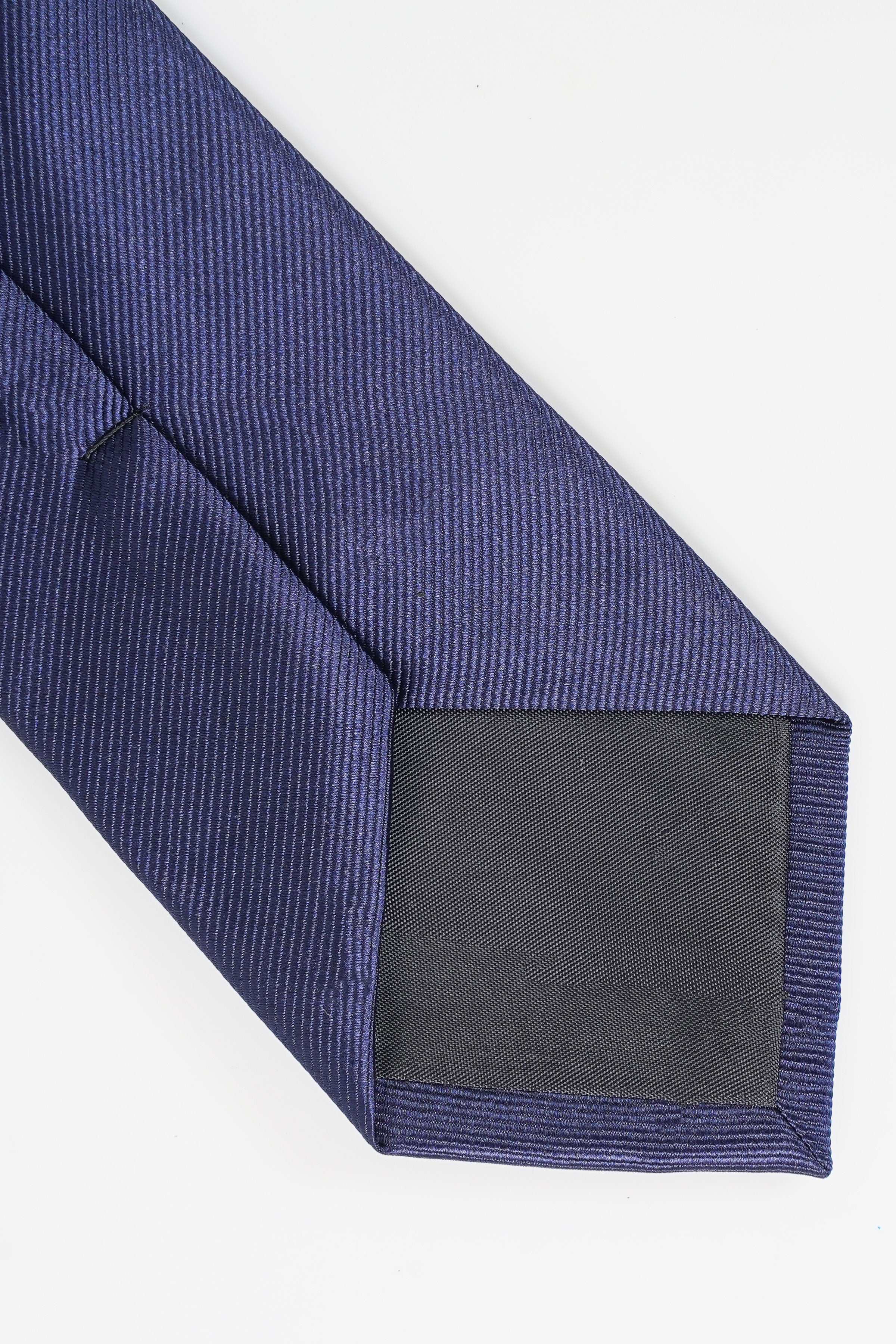 Poly silk tie end with dark lining and dark-blue woven texture.