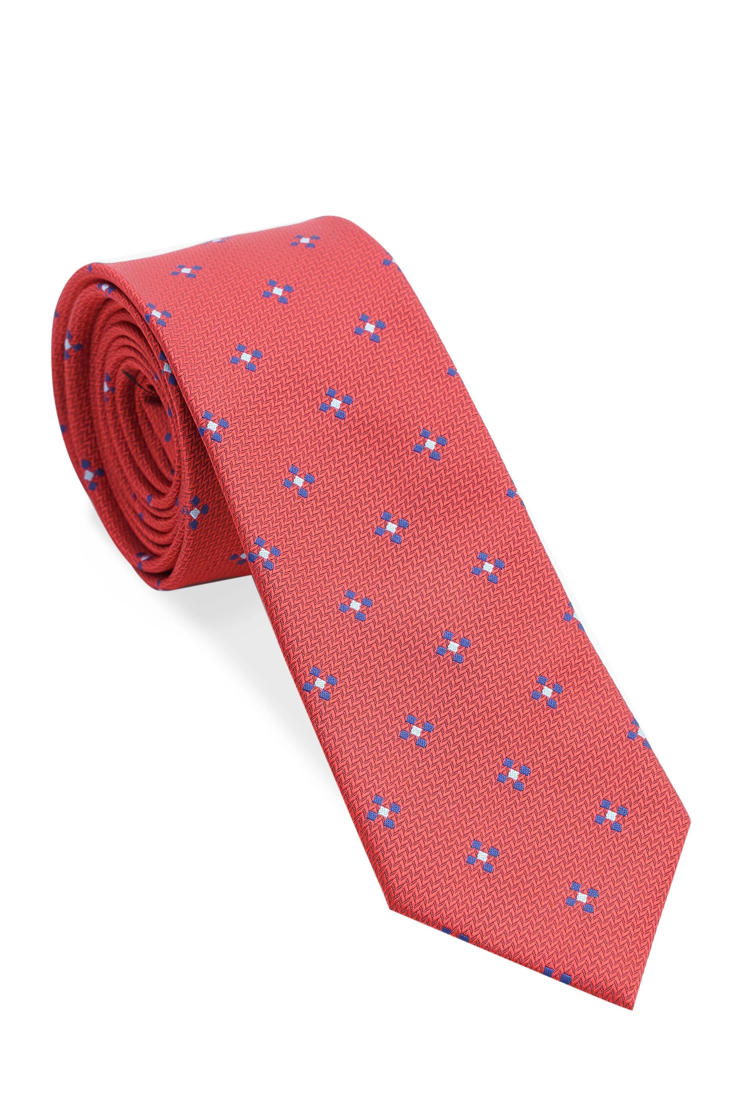 Red necktie rolled view, blue geometric motifs on woven polyester silk