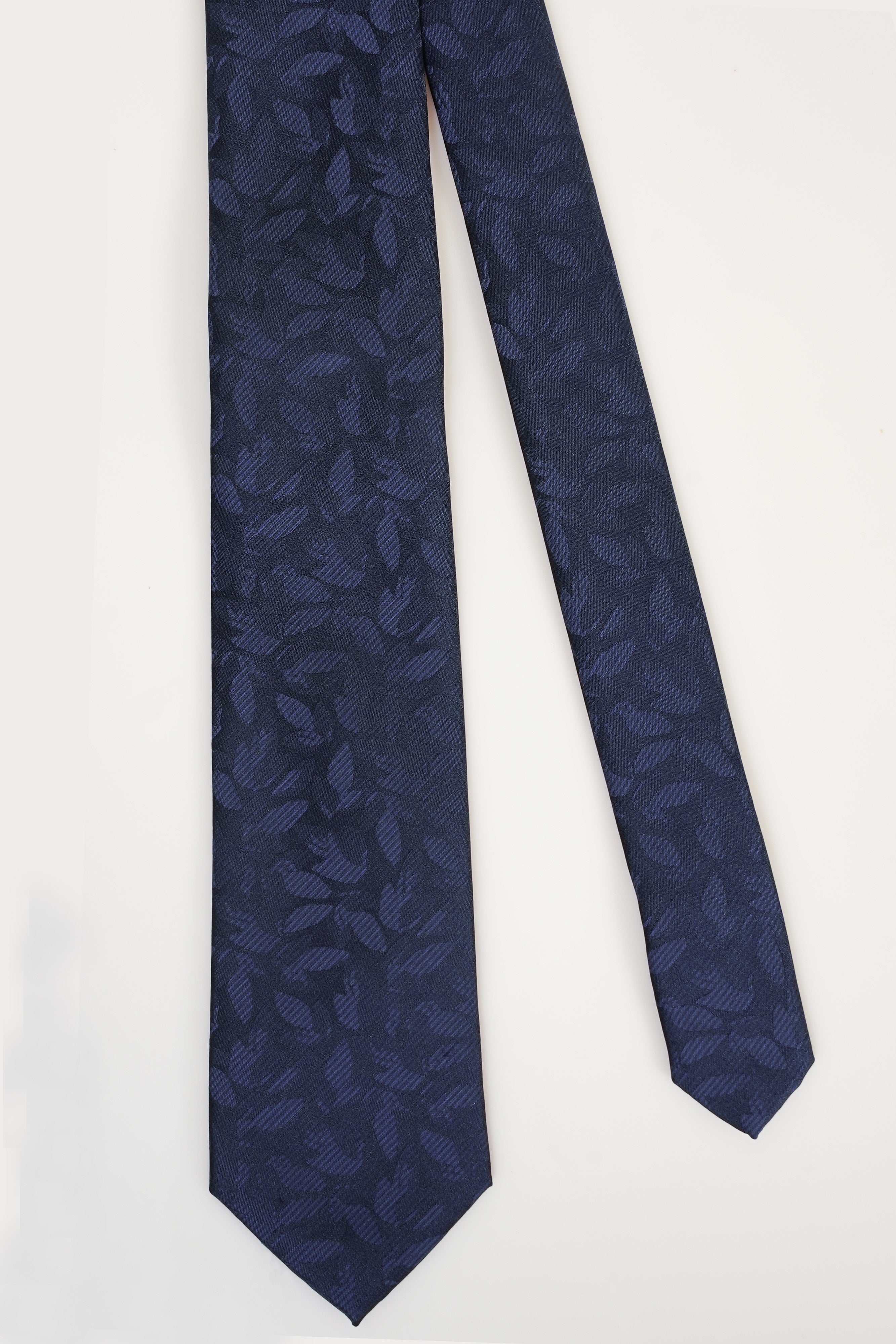 Navy poly silk tie with dark geometric pattern, pointed end