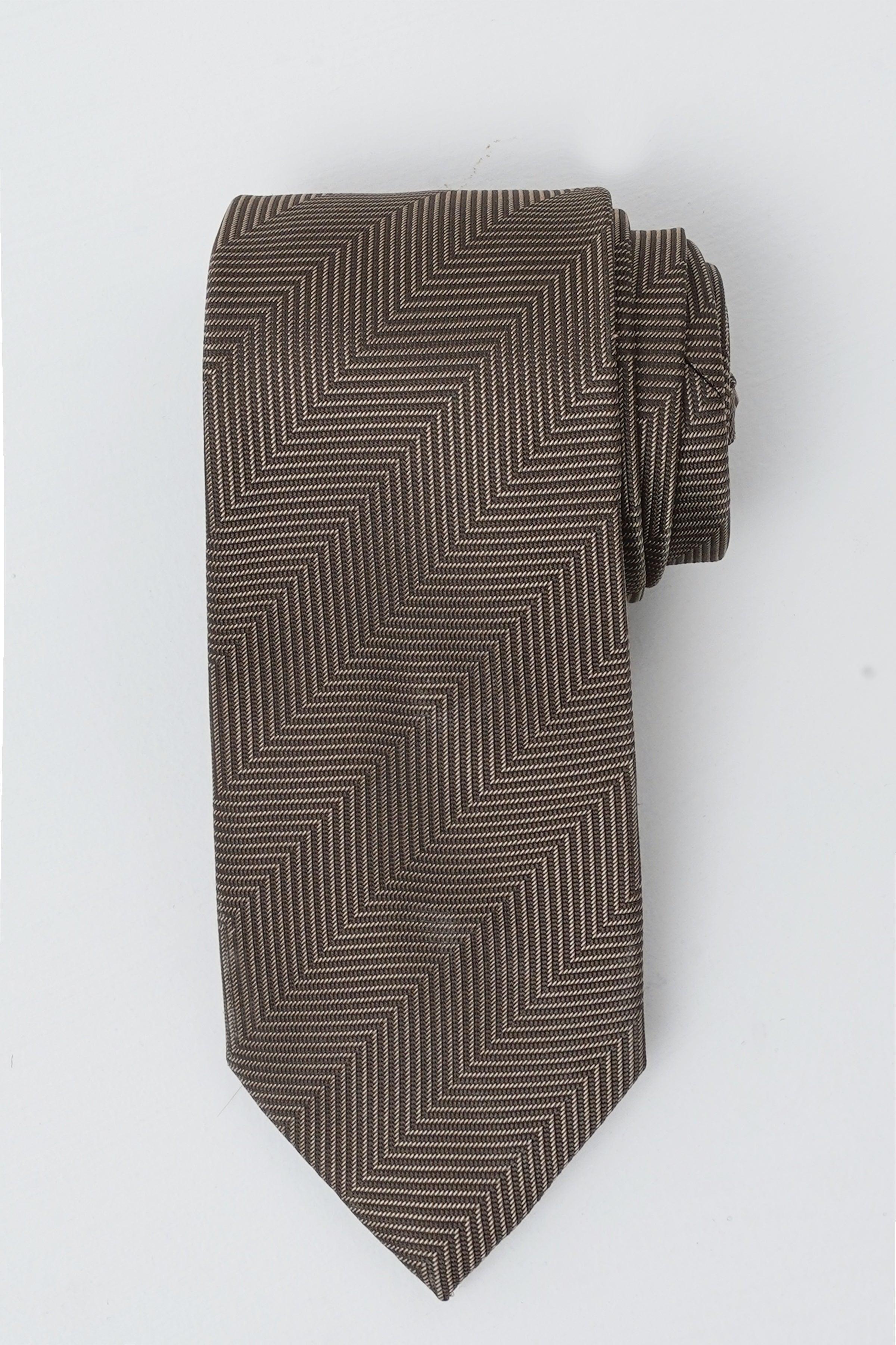 Poly silk tie in charcoal with zigzag pattern and pointed end.