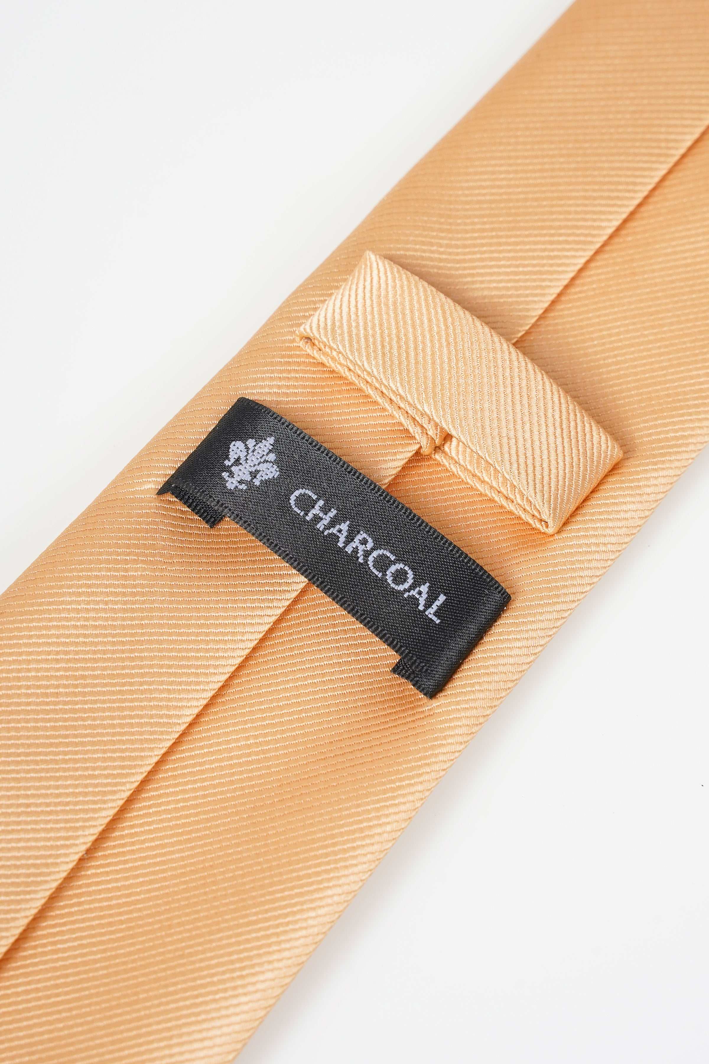 Beige necktie inner keeper with CHARCOAL label