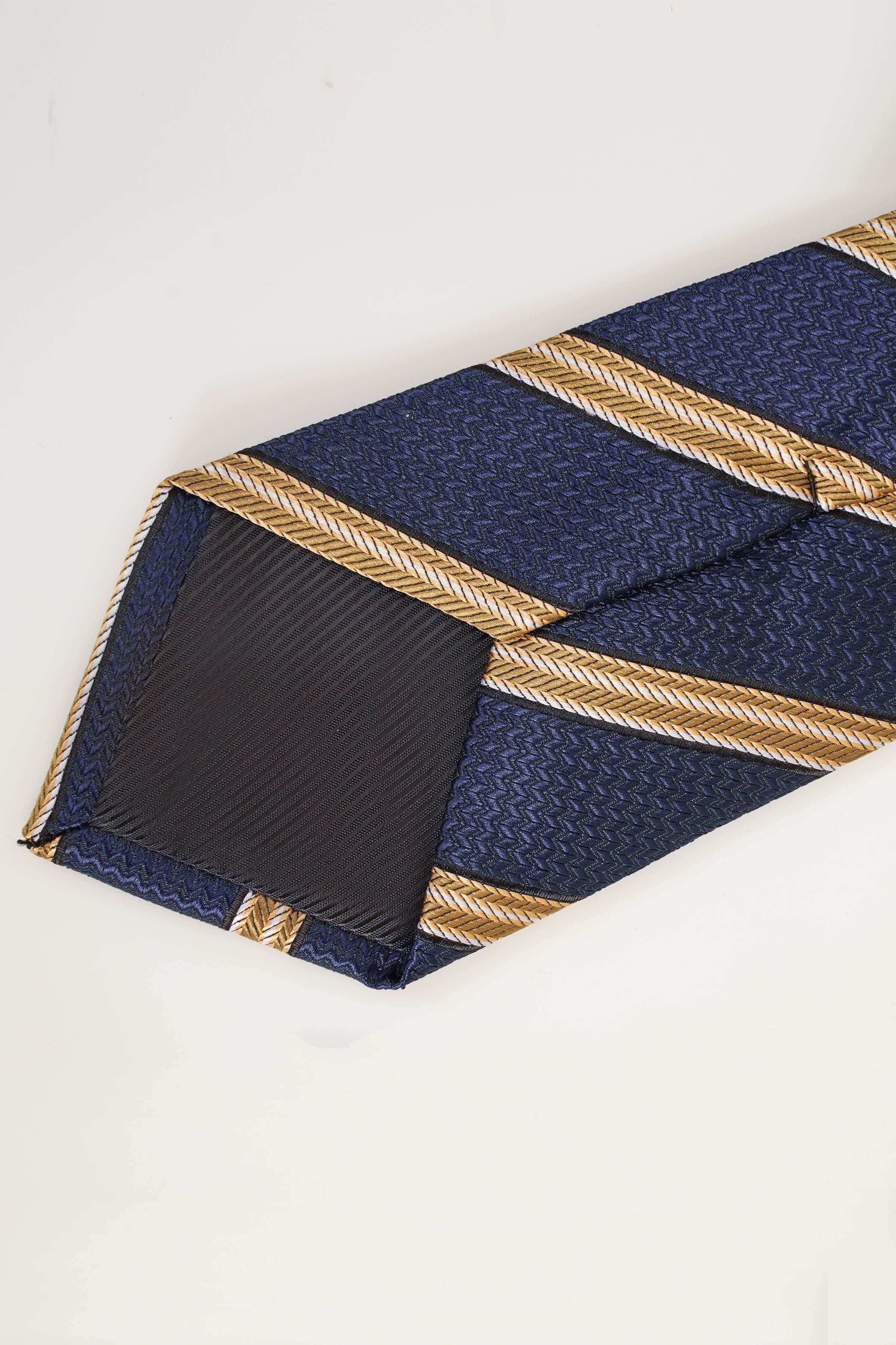 Navy necktie with gold diagonal stripes, folded near the knot