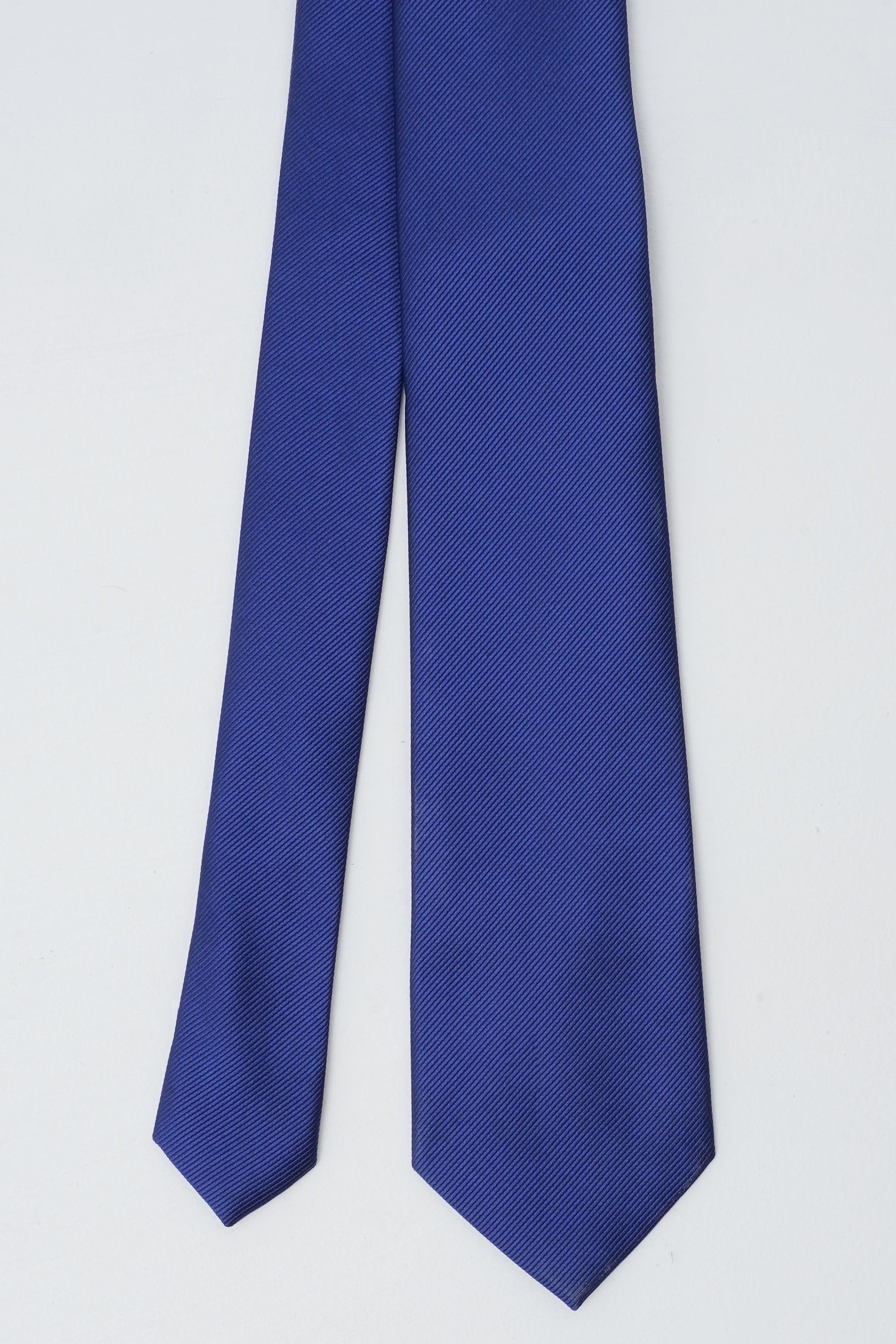 Blue textured polyester silk tie, angled view of the blade