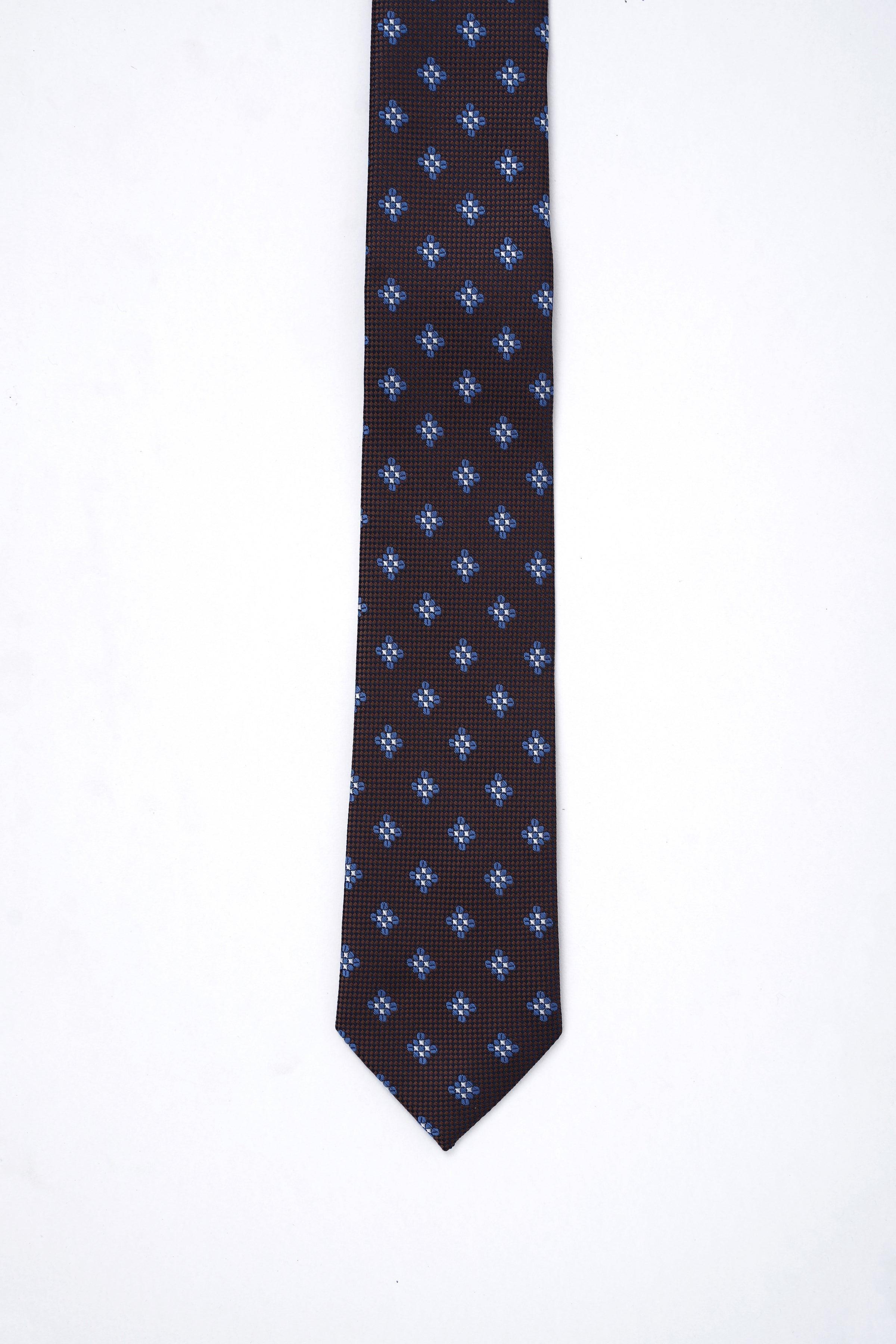 Dark brown slim necktie with repeating blue quatrefoil pattern.