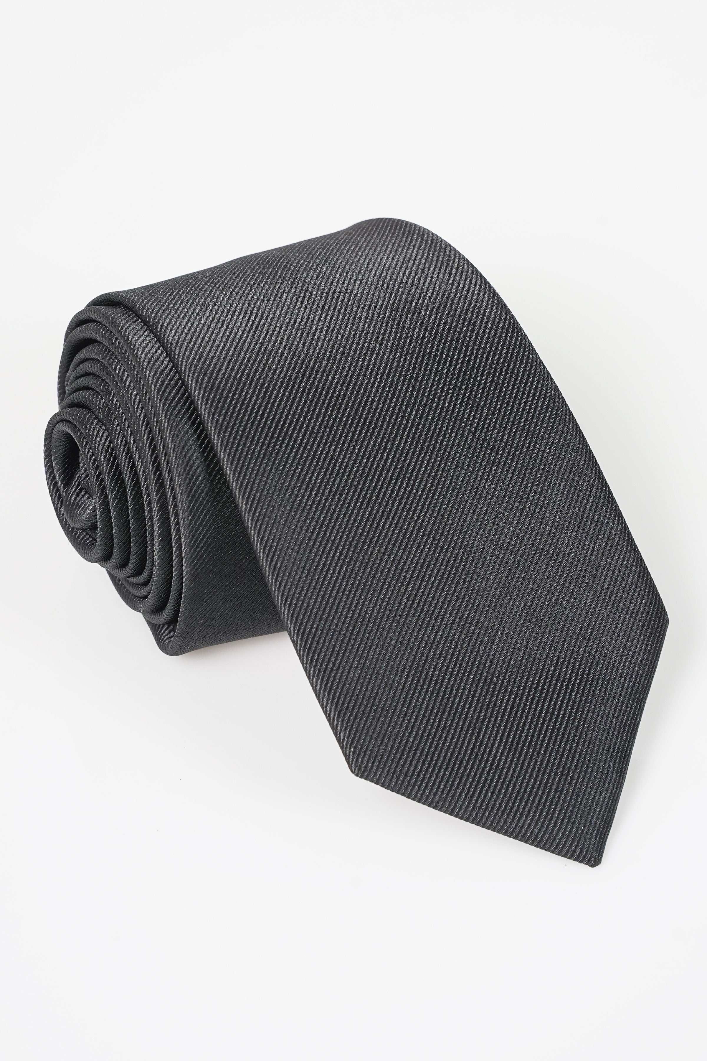 Dark poly silk tie rolled up, textured diagonal pattern