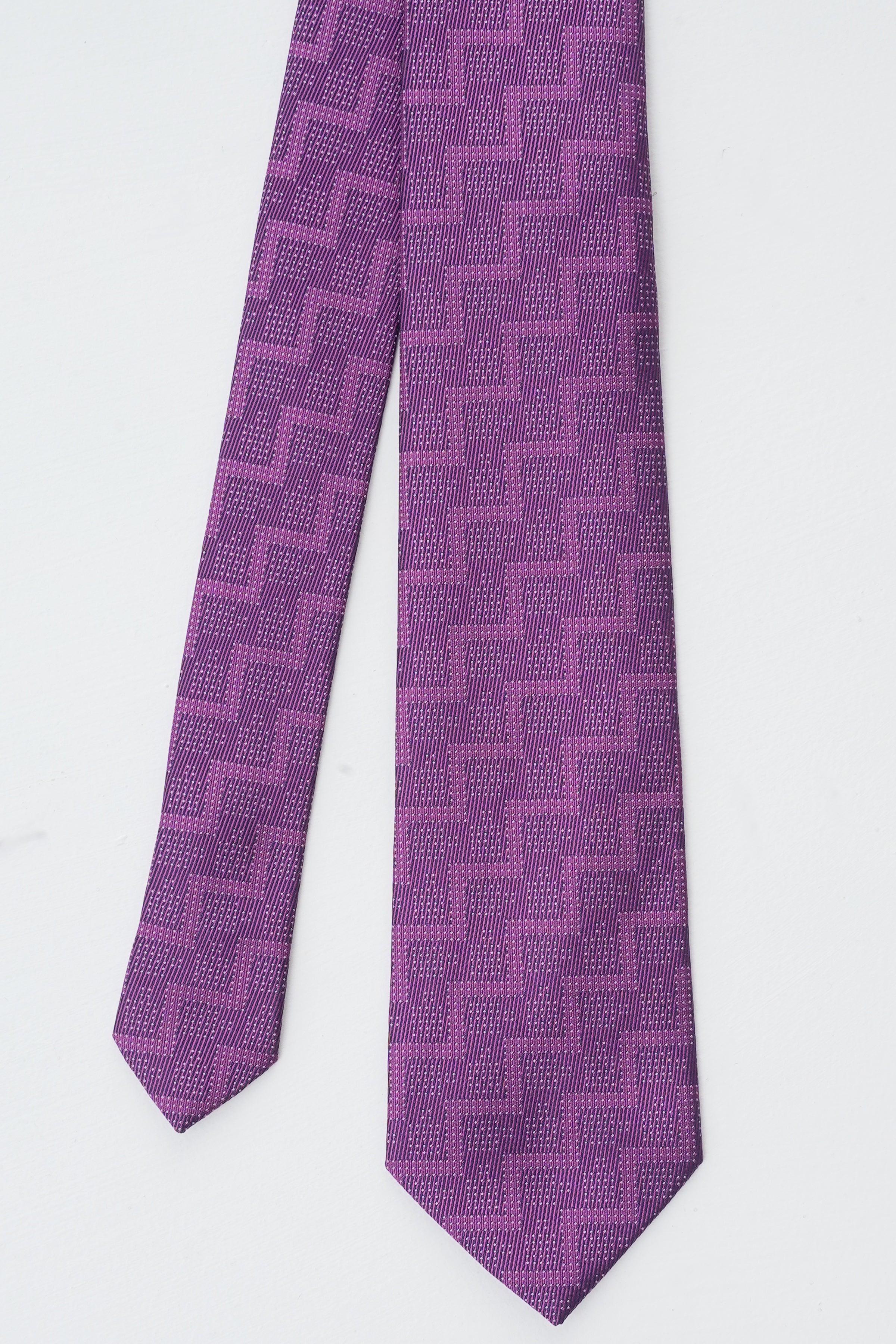 Purple patterned necktie with interlocking square motif, full length view