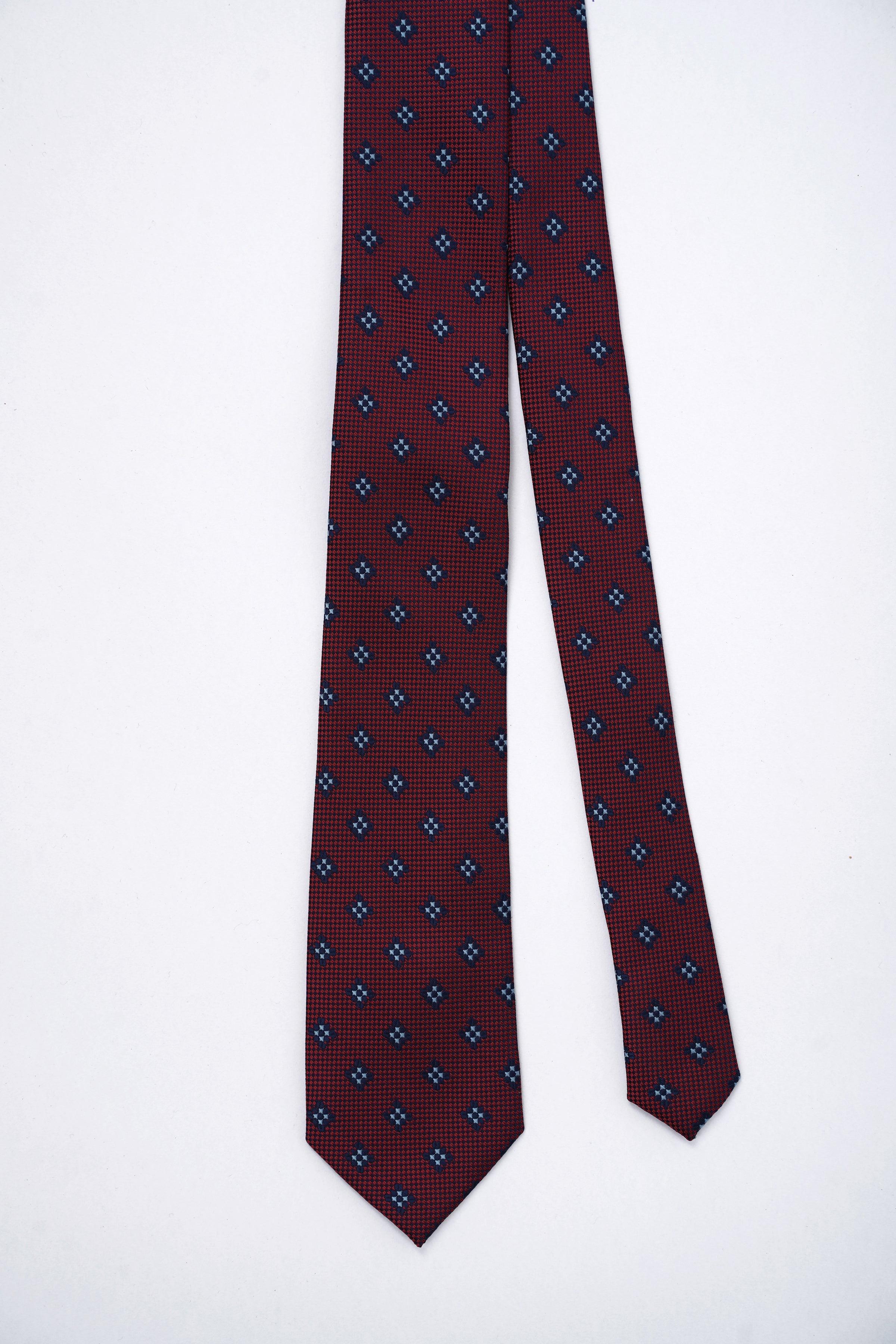 Poly silk tie full length; burgundy with navy geometric pattern