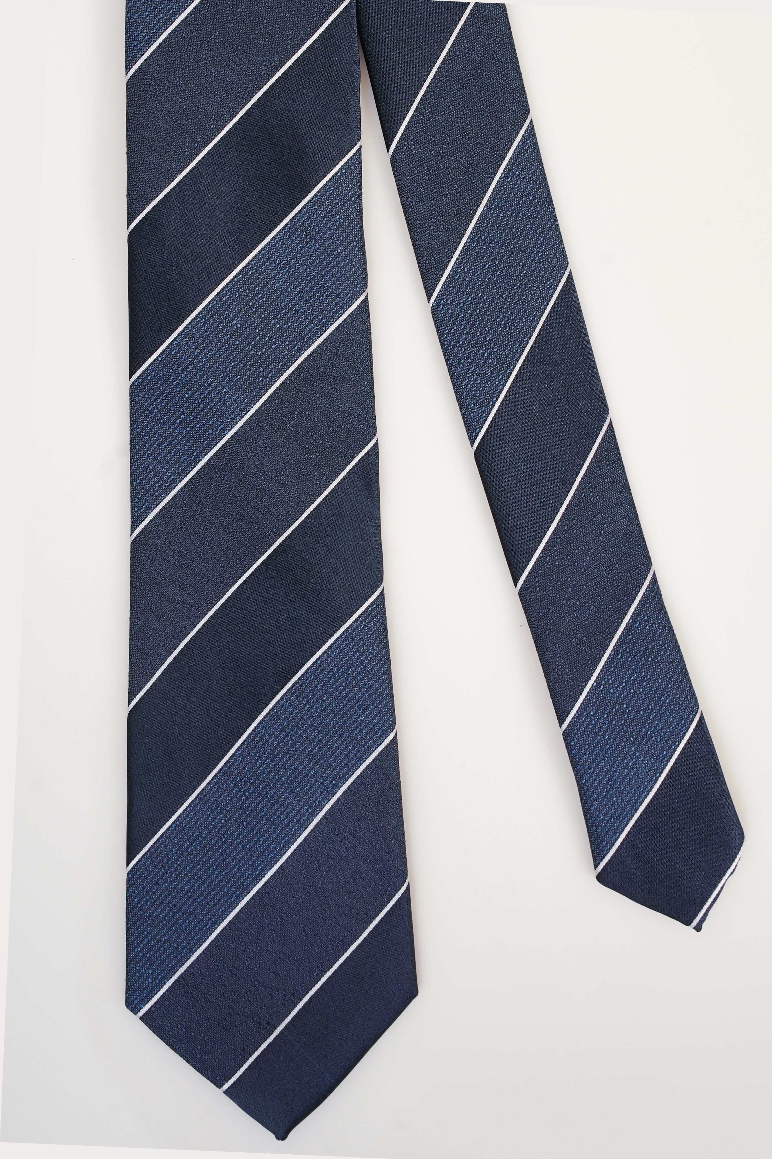 Poly silk tie with dark navy base and white diagonal stripe pattern
