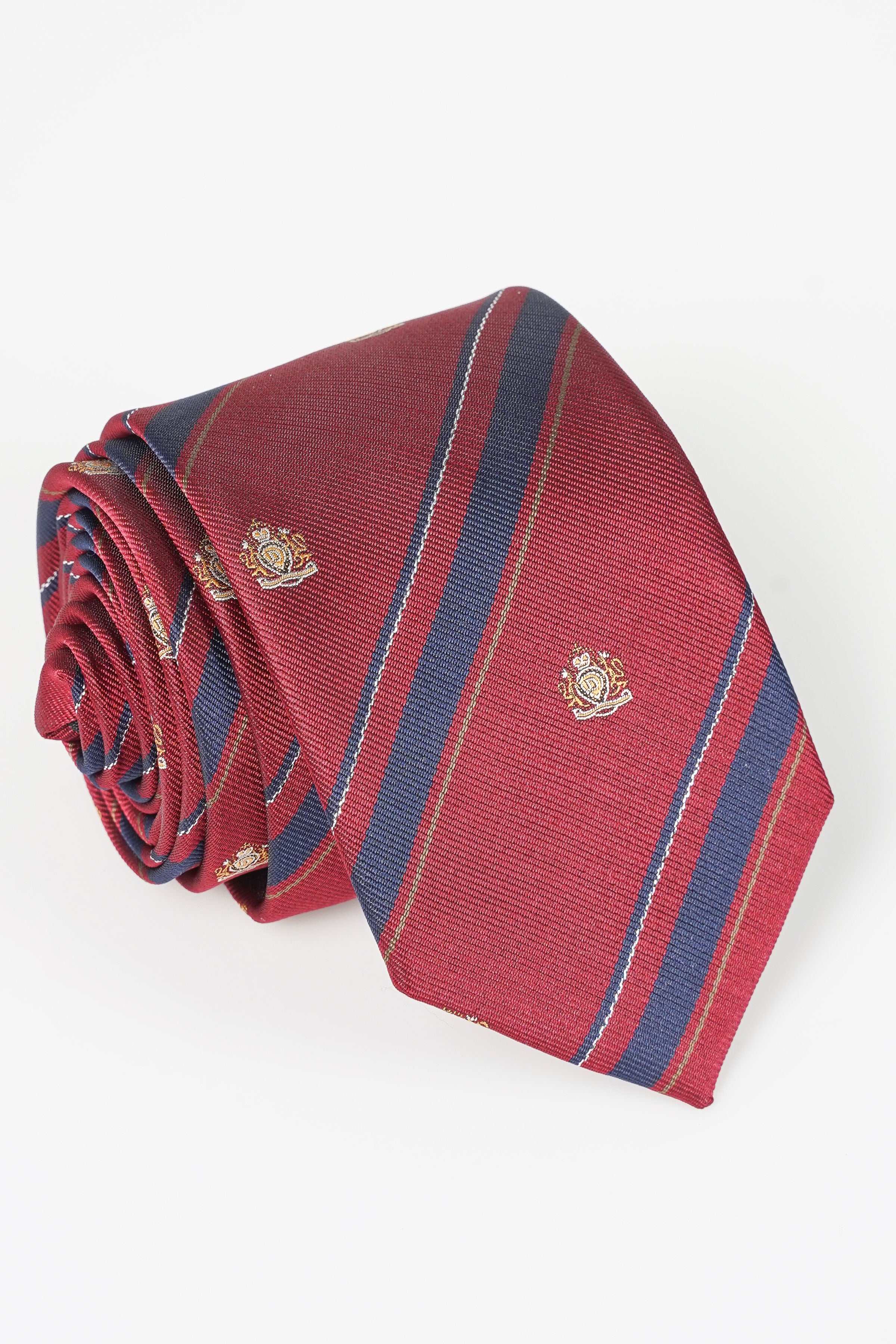 Red necktie with navy and blue stripes and small gold crest motifs