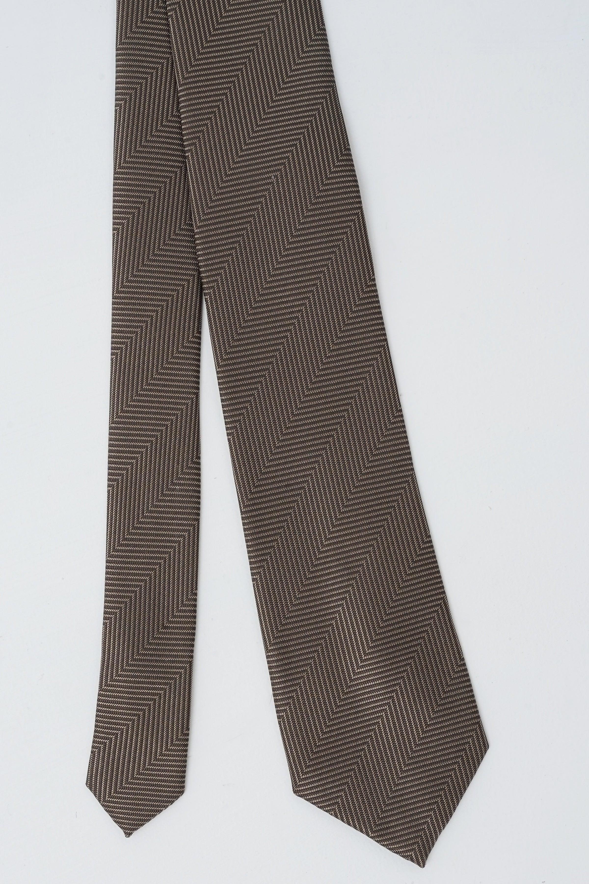 Poly silk tie charcoal zigzag pattern shown from side, pointed ends.