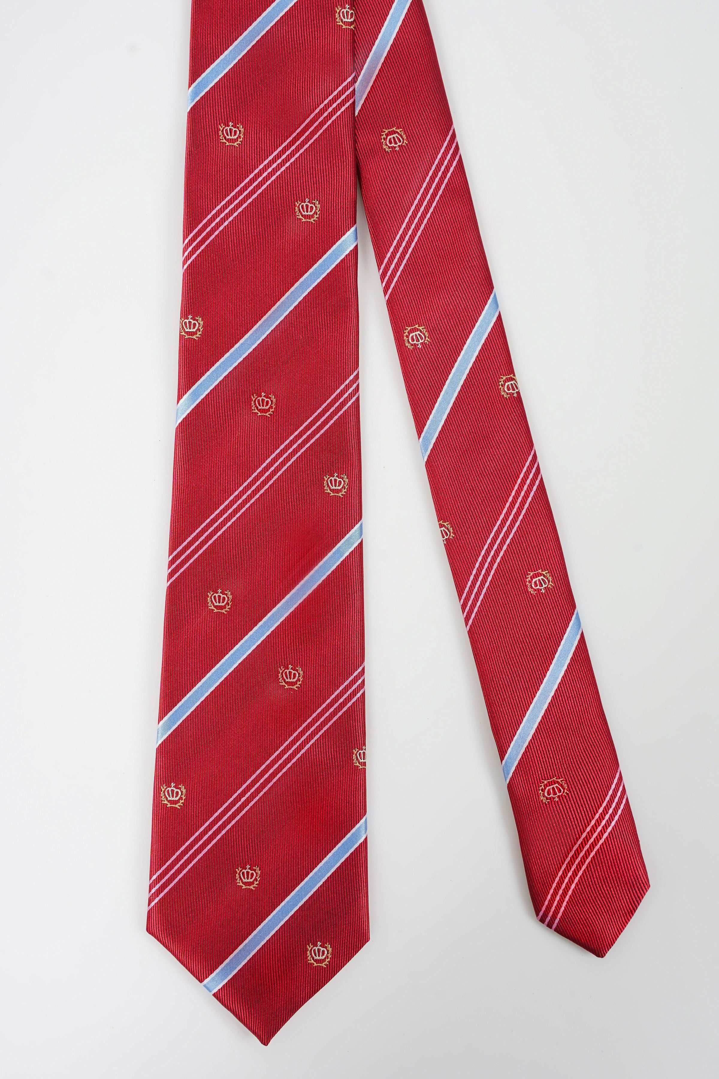 Red necktie with light blue diagonal stripes and small crest pattern
