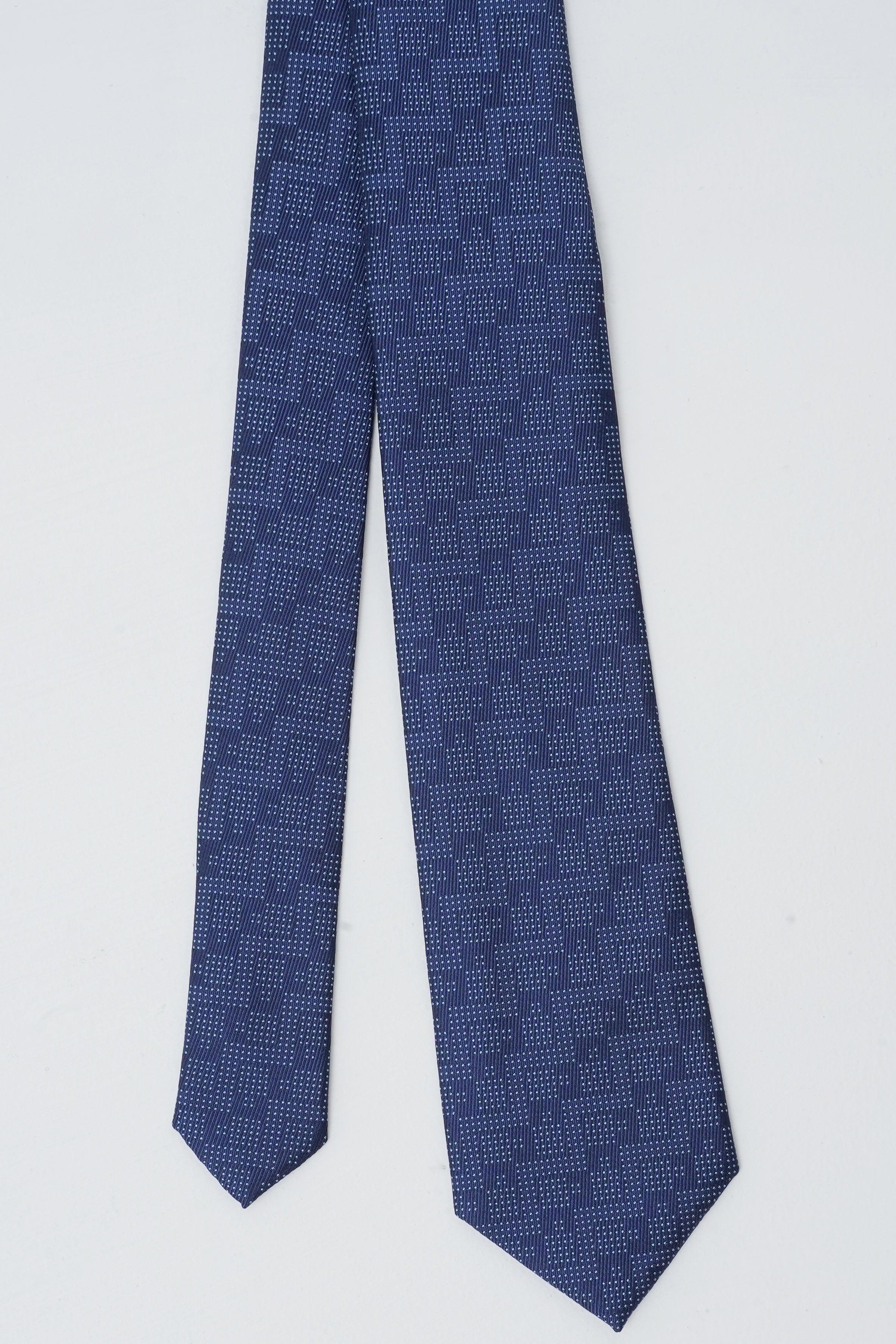 Navy blue poly silk tie with geometric dot pattern, folded length