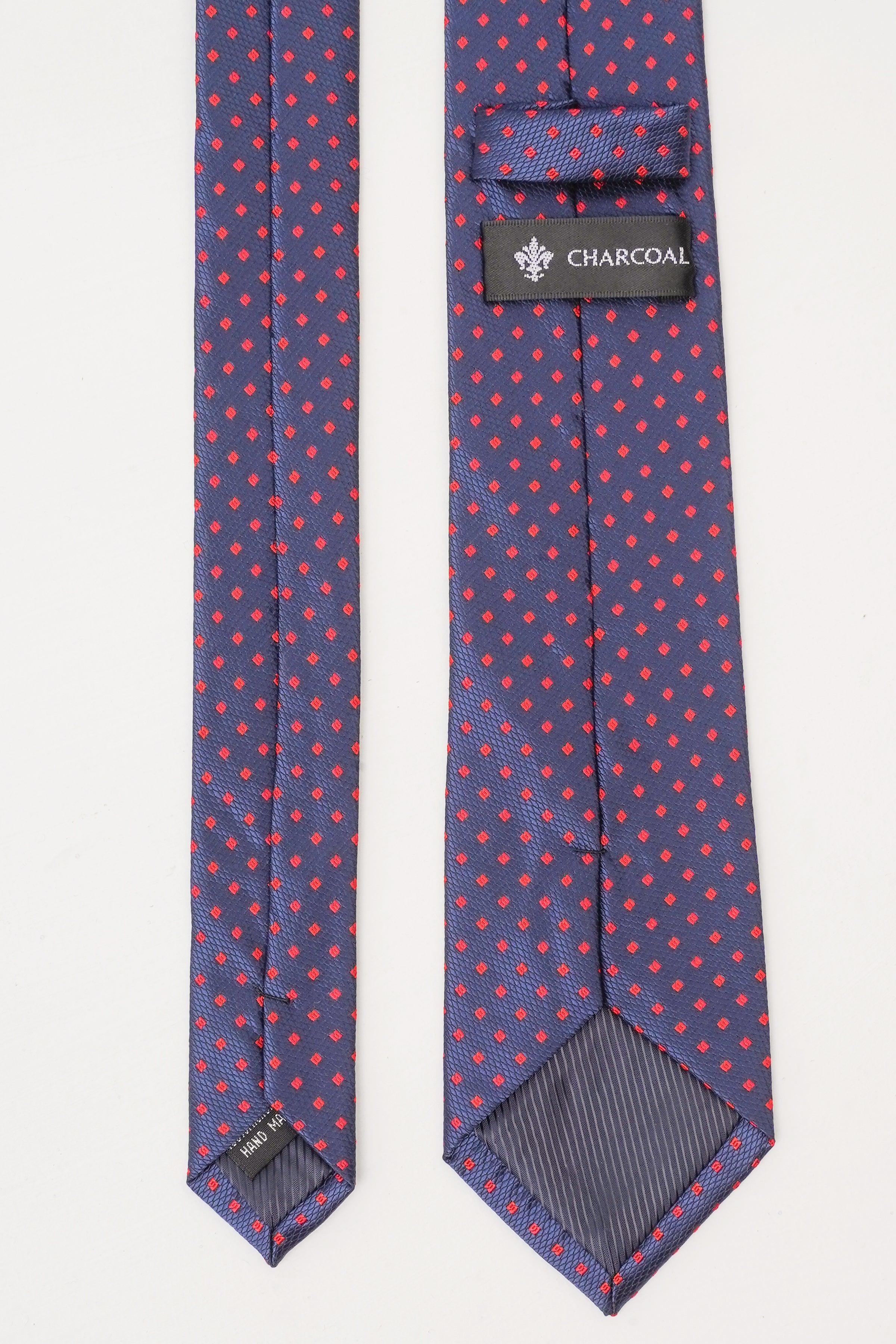 Navy poly silk tie, red and blue dot pattern, CHARCOAL label on fold