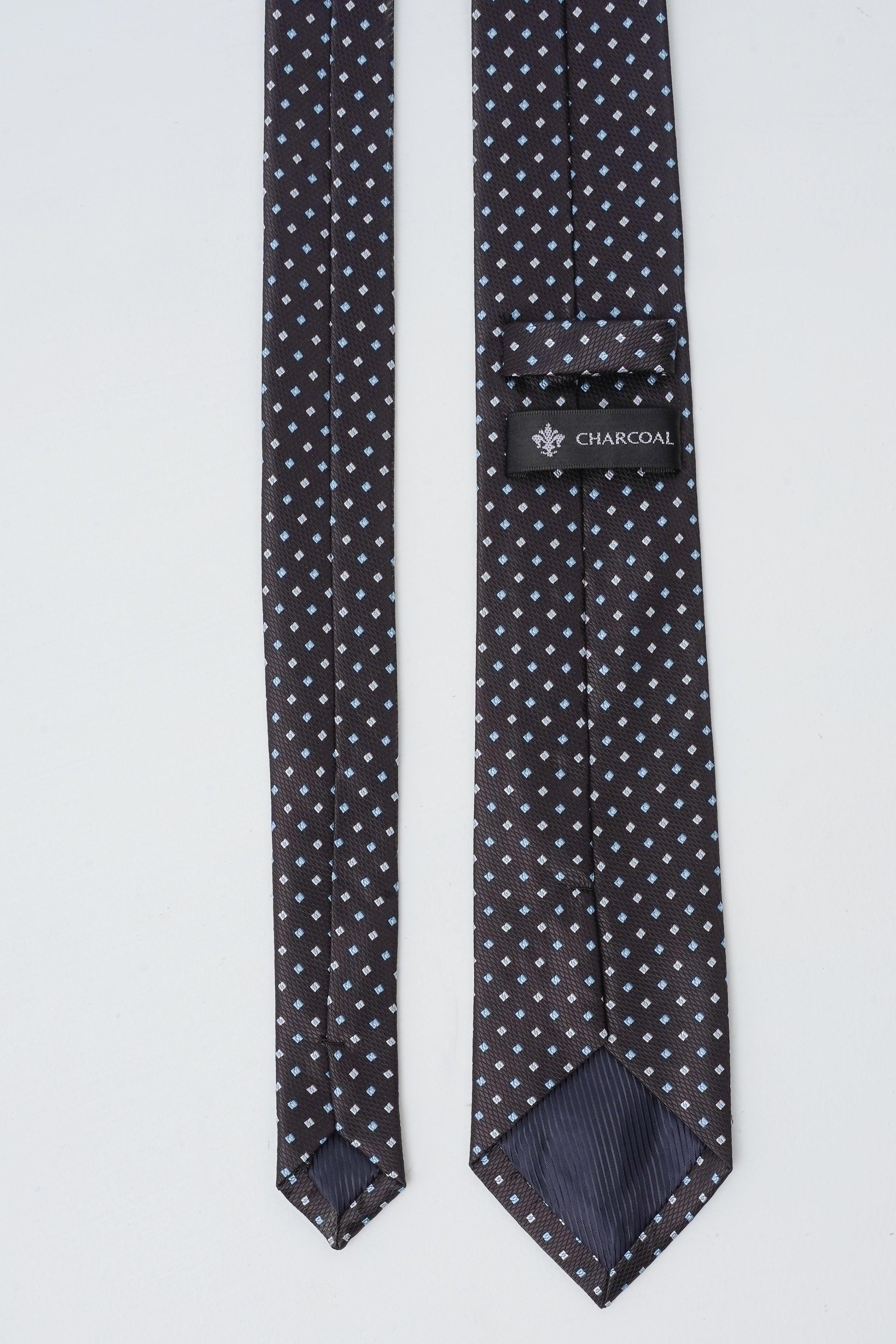 Dark geometric-pattern tie with fold-over tail and Charcoal label