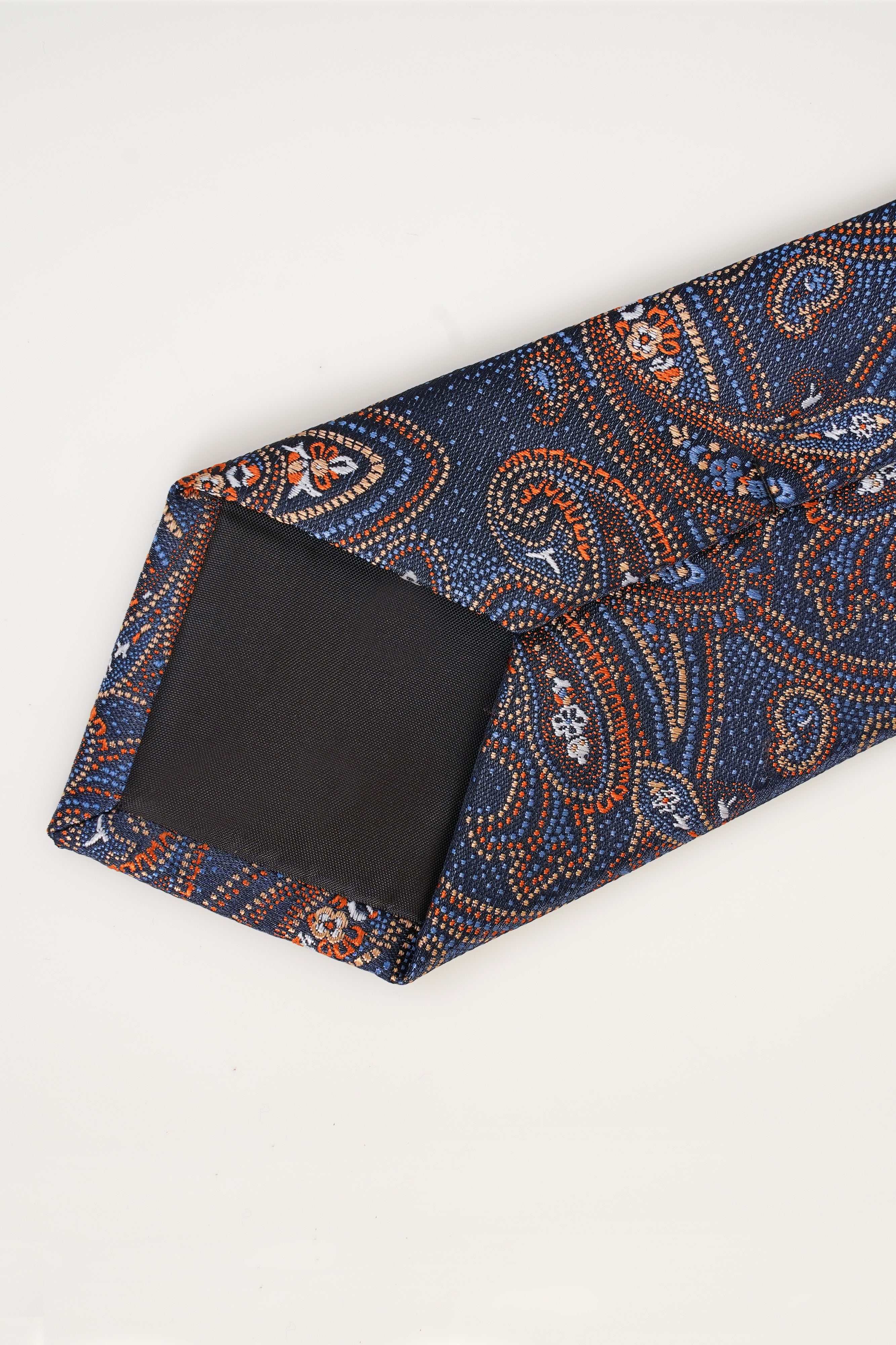 Poly silk tie with dark paisley print, wide end and label area visible