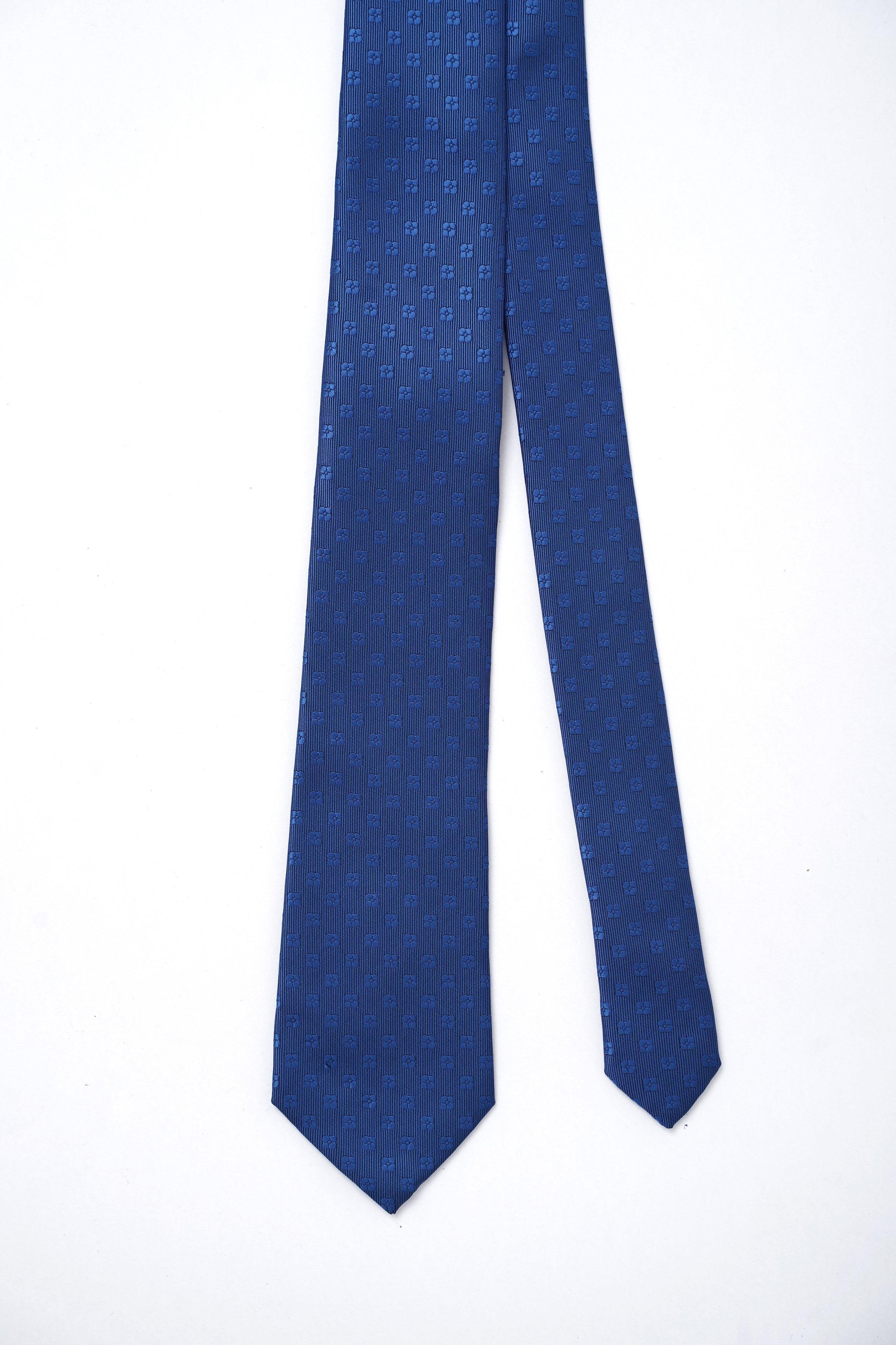 Navy blue necktie with repeated small square motif