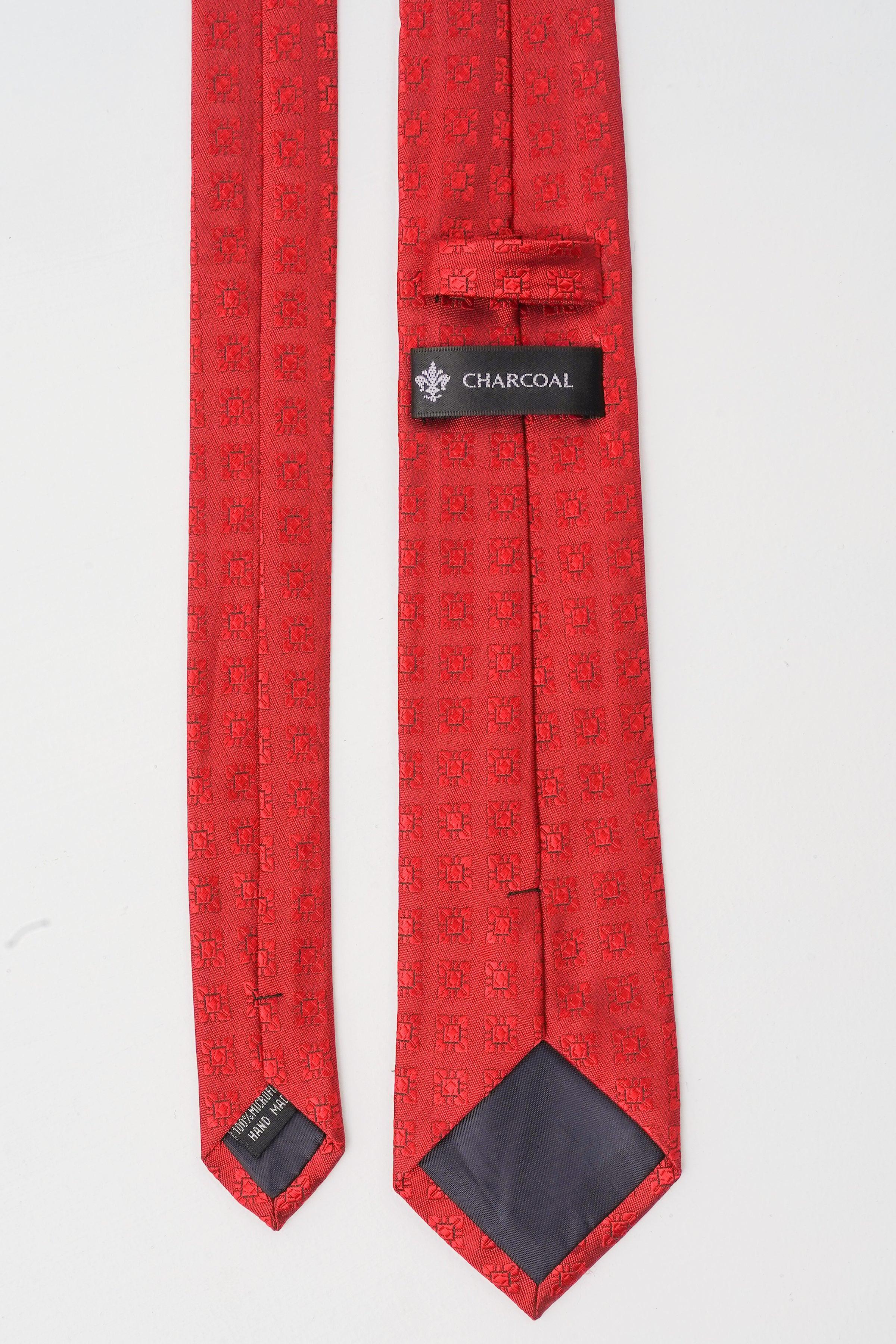 Red patterned polyester silk tie with Charcoal label and dark keeper